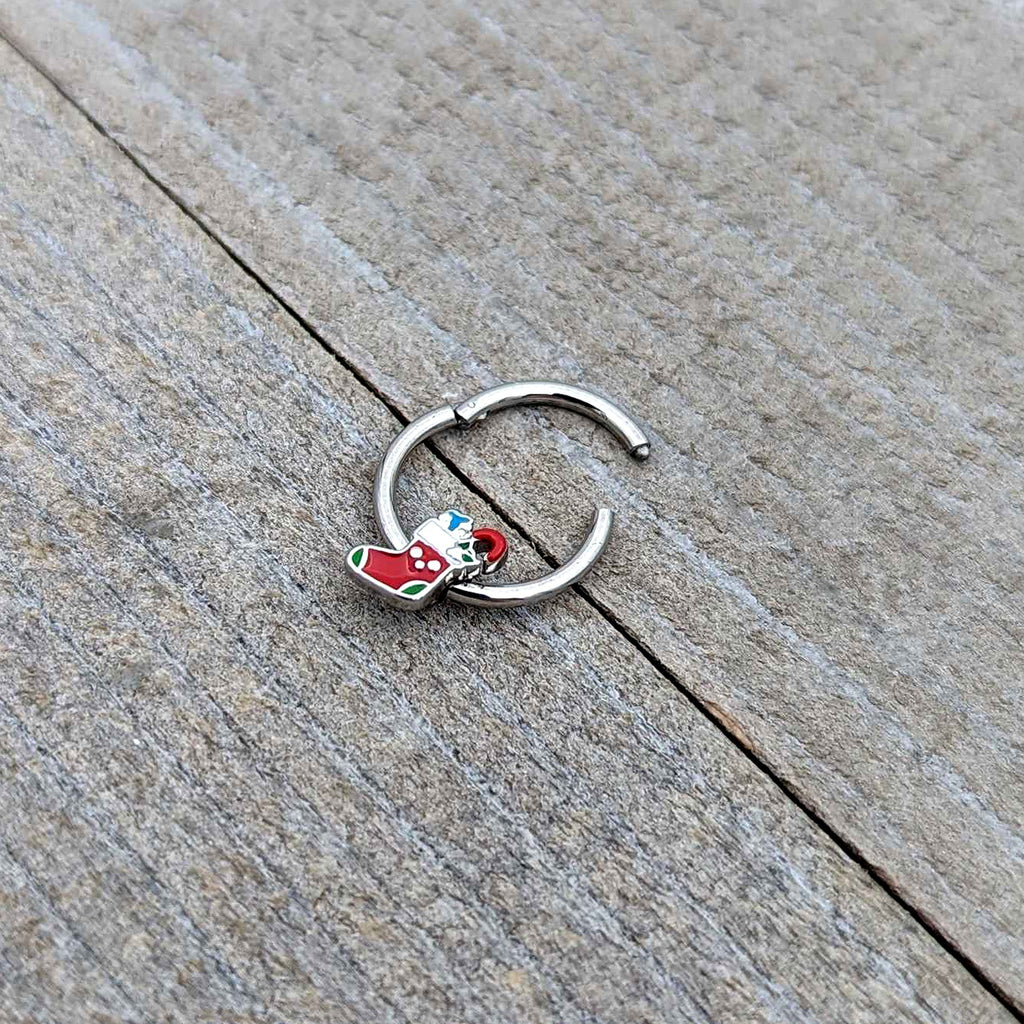 BodyCandy 16G 3/8 Happy Christmas Stocking Red Green Hinged Segment Ring — in-use photo