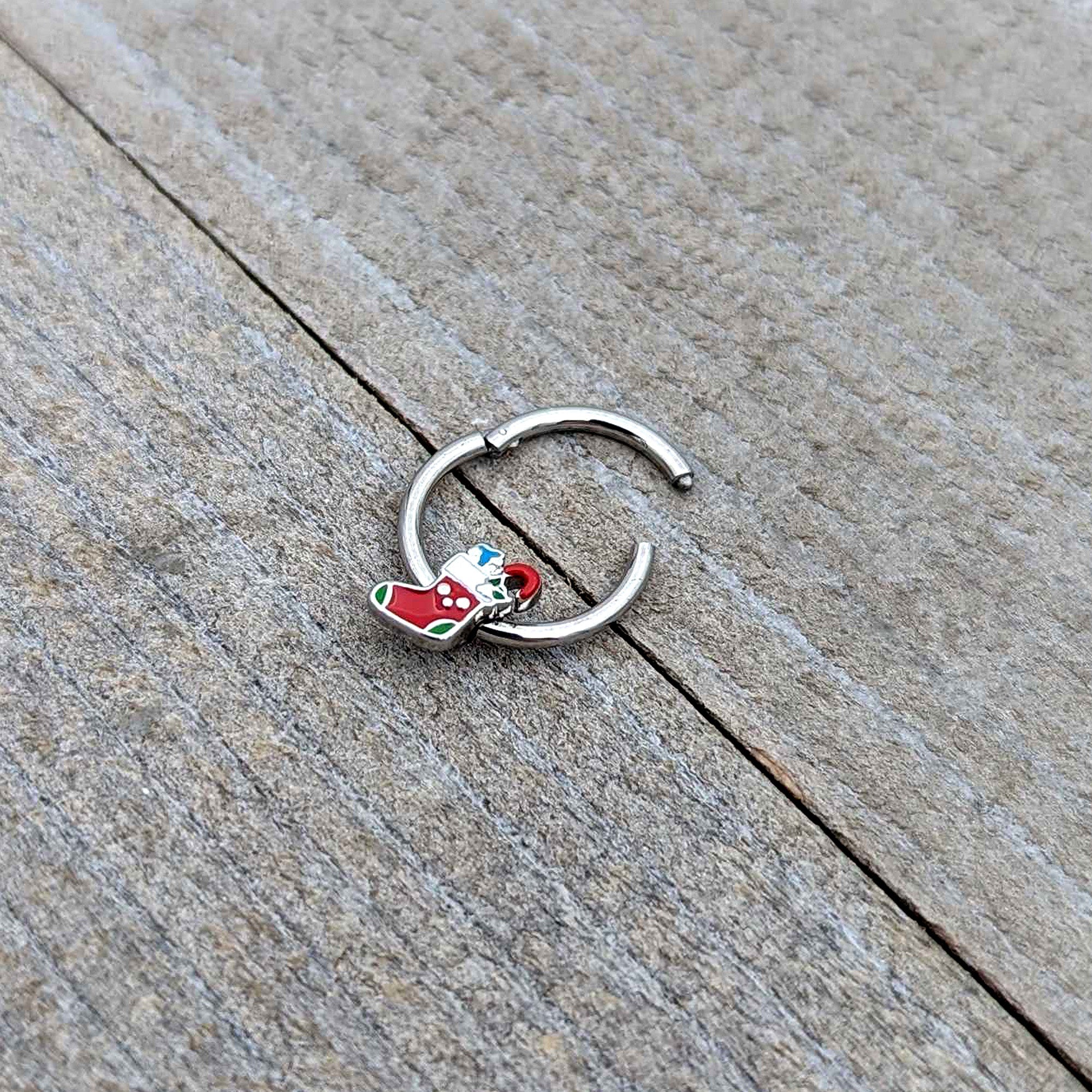 BodyCandy 16G 3/8 Happy Christmas Stocking Red Green Hinged Segment Ring — in-use photo