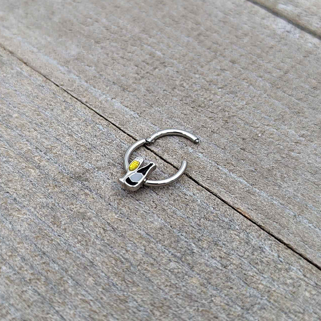 BodyCandy 16G 3/8 Champagne Bottle Flute Yellow Hinged Segment Ring — in-use photo