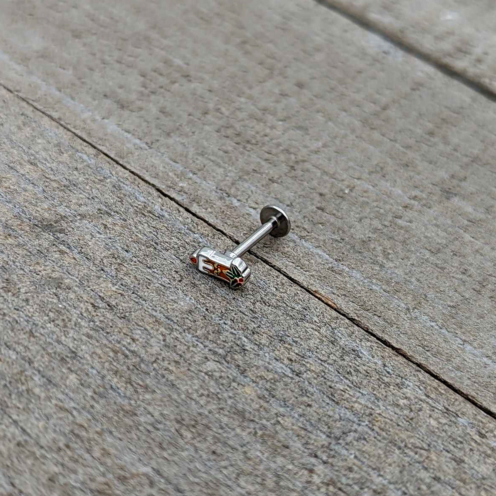 BodyCandy 16G 5/16 Sweet Holiday Christmas Candle Labret Monroe Tragus — in-use photo
