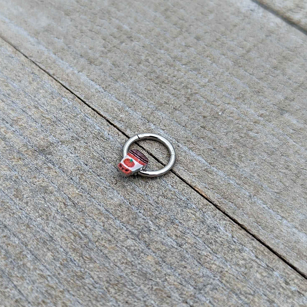 BodyCandy 16G 5/16 Sweet Pumpkin Latte Autumn Hinged Segment Ring — in-use photo