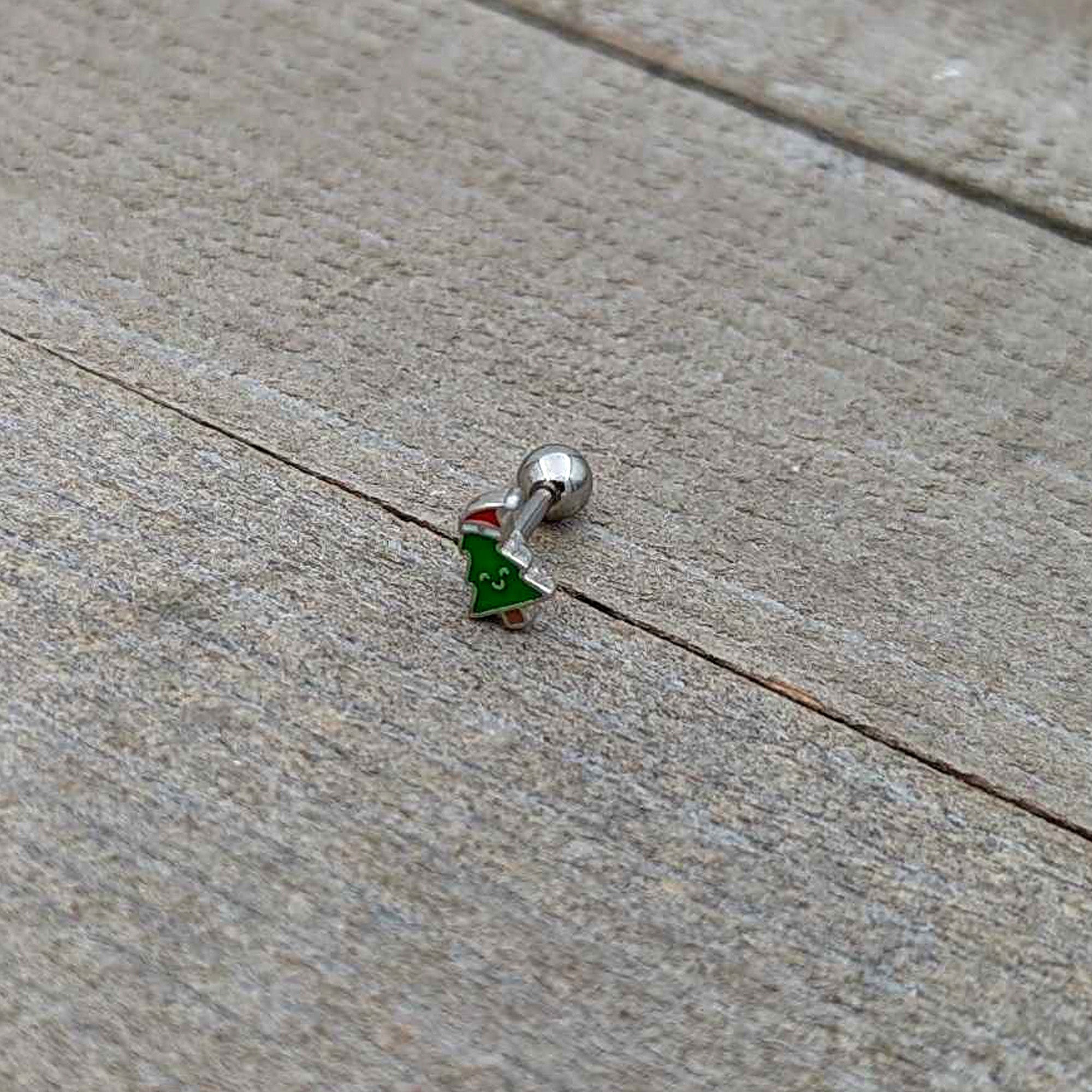 BodyCandy 16G 1/4 Happy Christmas Tree Hat Cartilage Tragus Earring — in-use photo