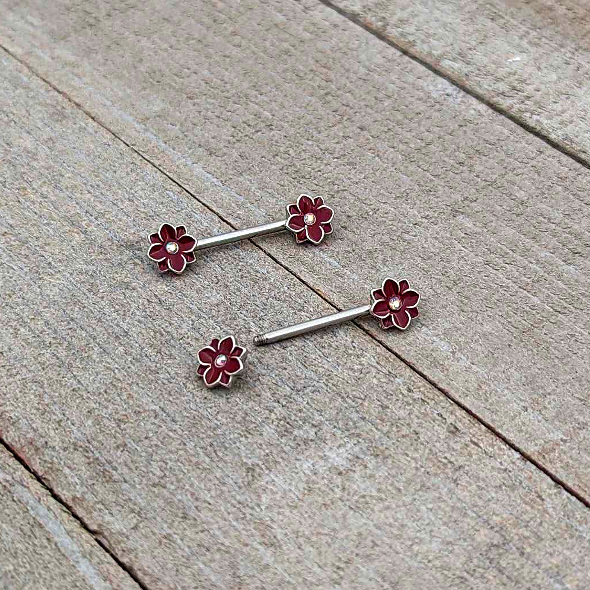 BodyCandy 14G 9/16 Aurora Gem Poinsettia Flower Barbell Nipple Ring Set — in-use photo