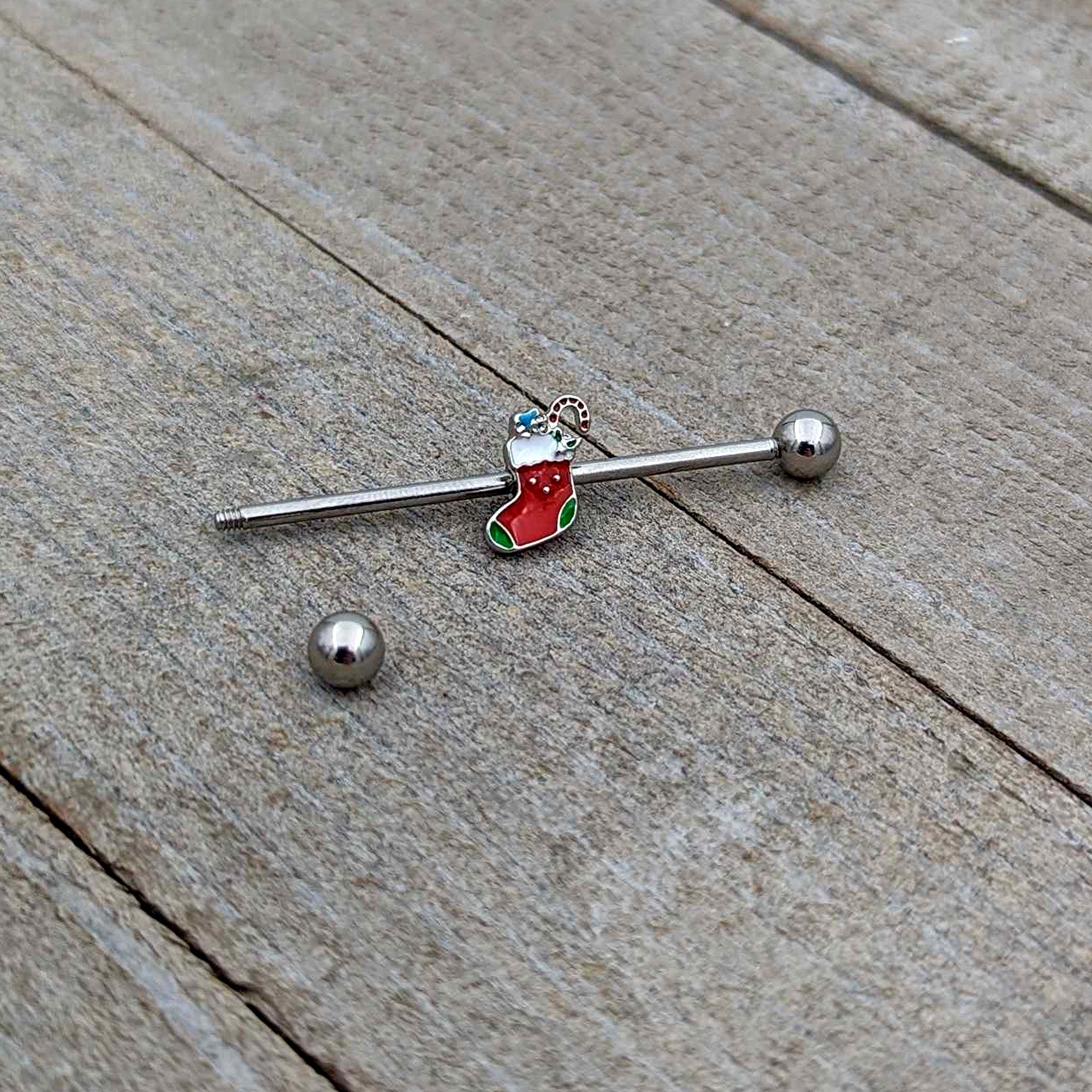 BodyCandy 14G Happy Christmas Stocking Red Green Industrial Barbell 38mm — in-use photo