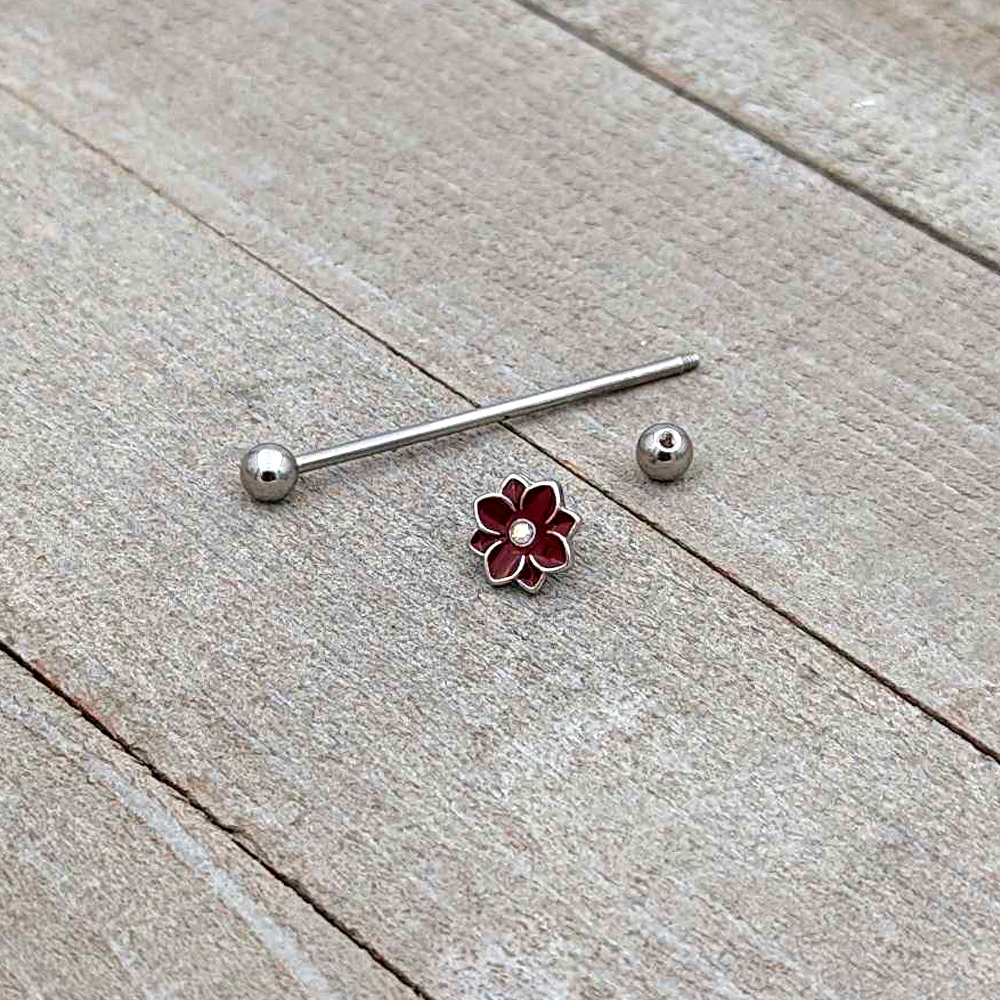 BodyCandy 14G Aurora Gem Poinsettia Flower Festive Industrial Barbell 38mm — in-use photo