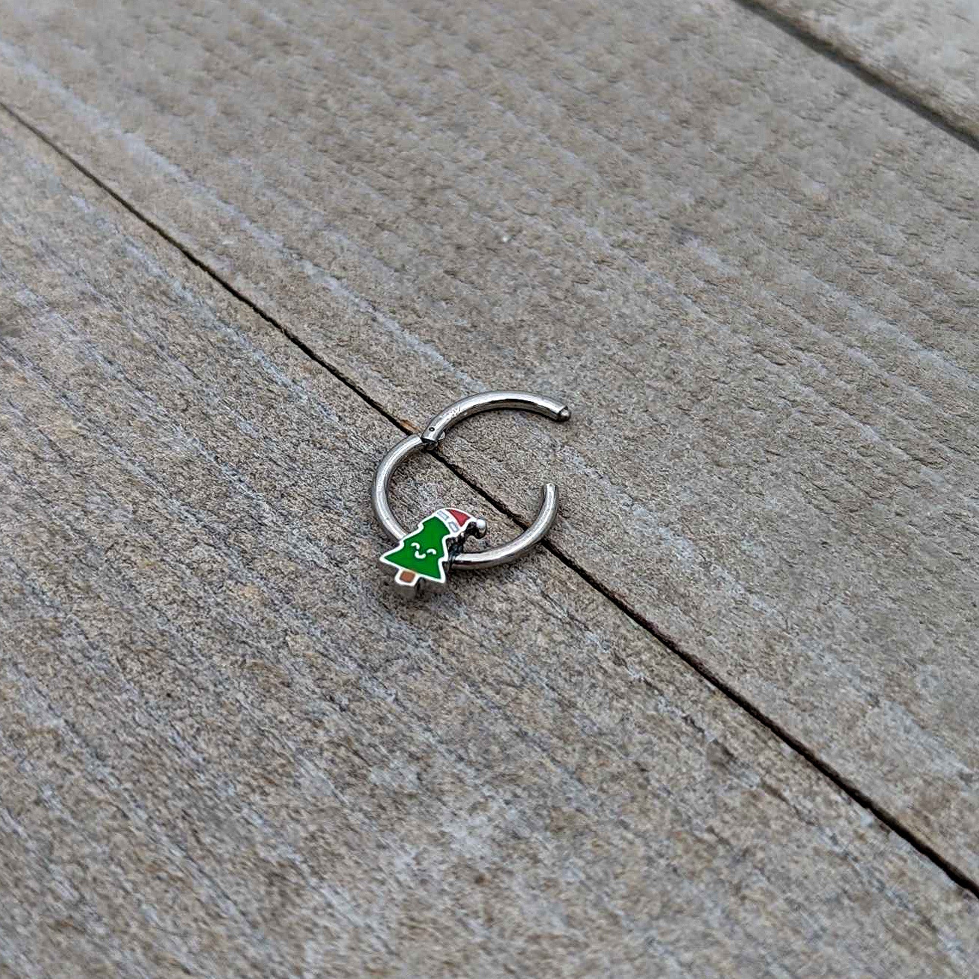 BodyCandy 16G 3/8 Happy Christmas Tree Holiday Hat Hinged Segment Ring — in-use photo
