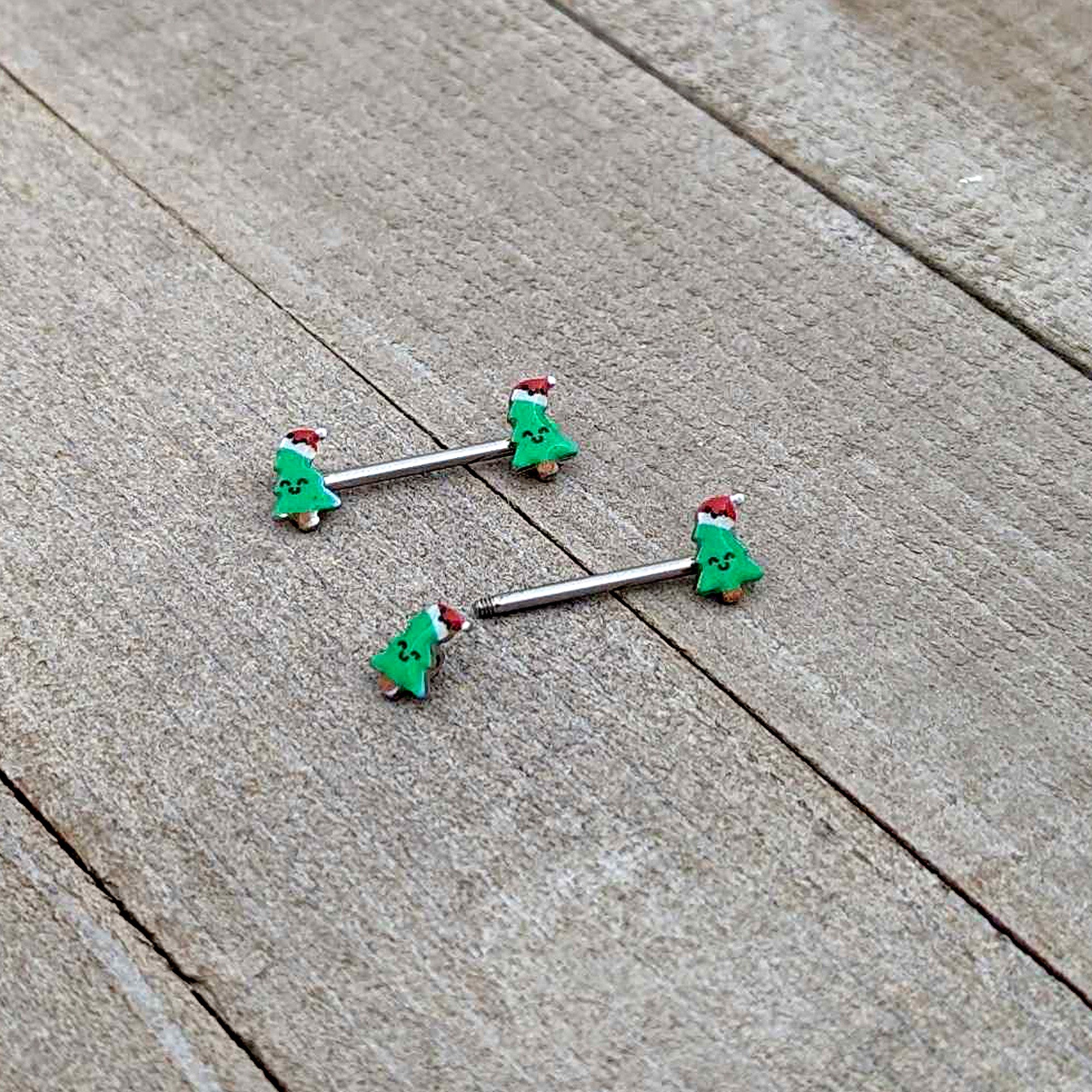 BodyCandy 14G 9/16 Happy Christmas Tree Hat Barbell Nipple Ring Set — in-use photo