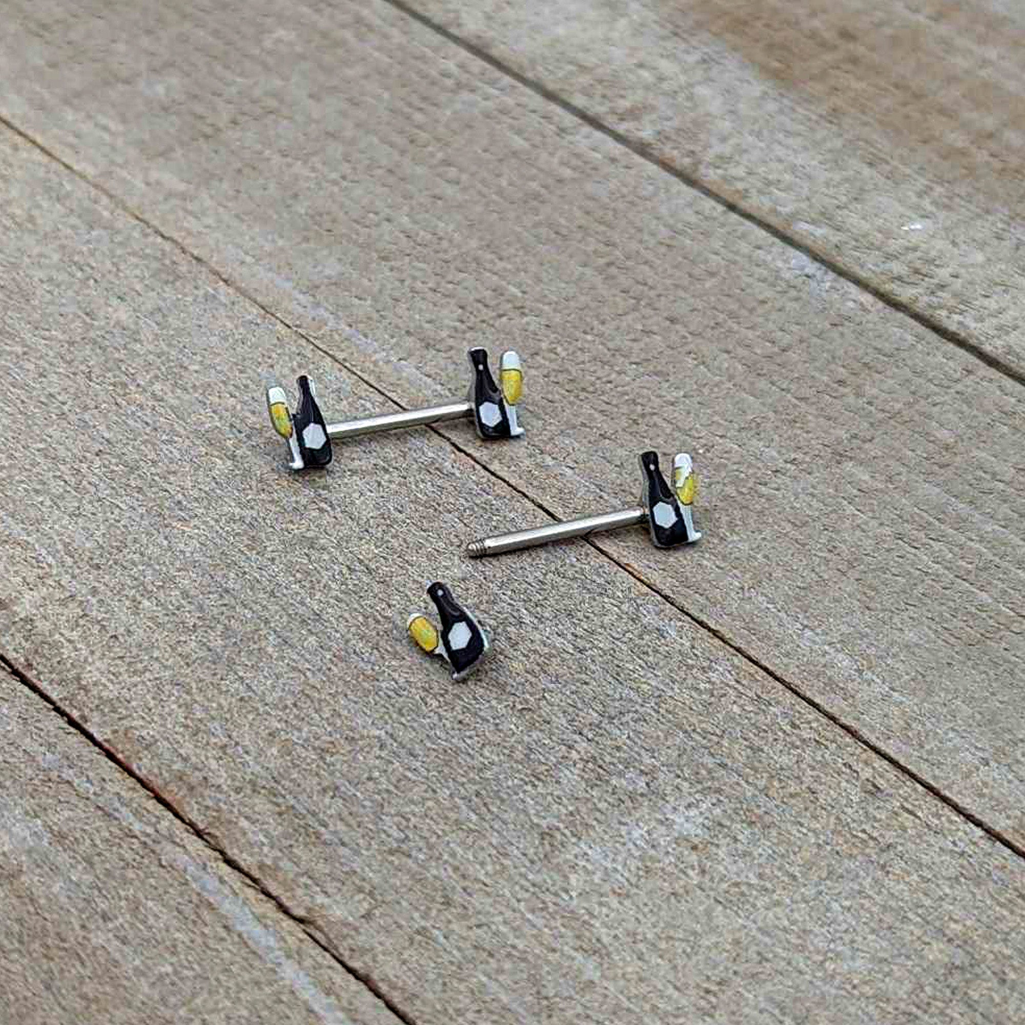 BodyCandy 14G 9/16 Champagne Bottle Flute Yellow Barbell Nipple Ring Set — in-use photo
