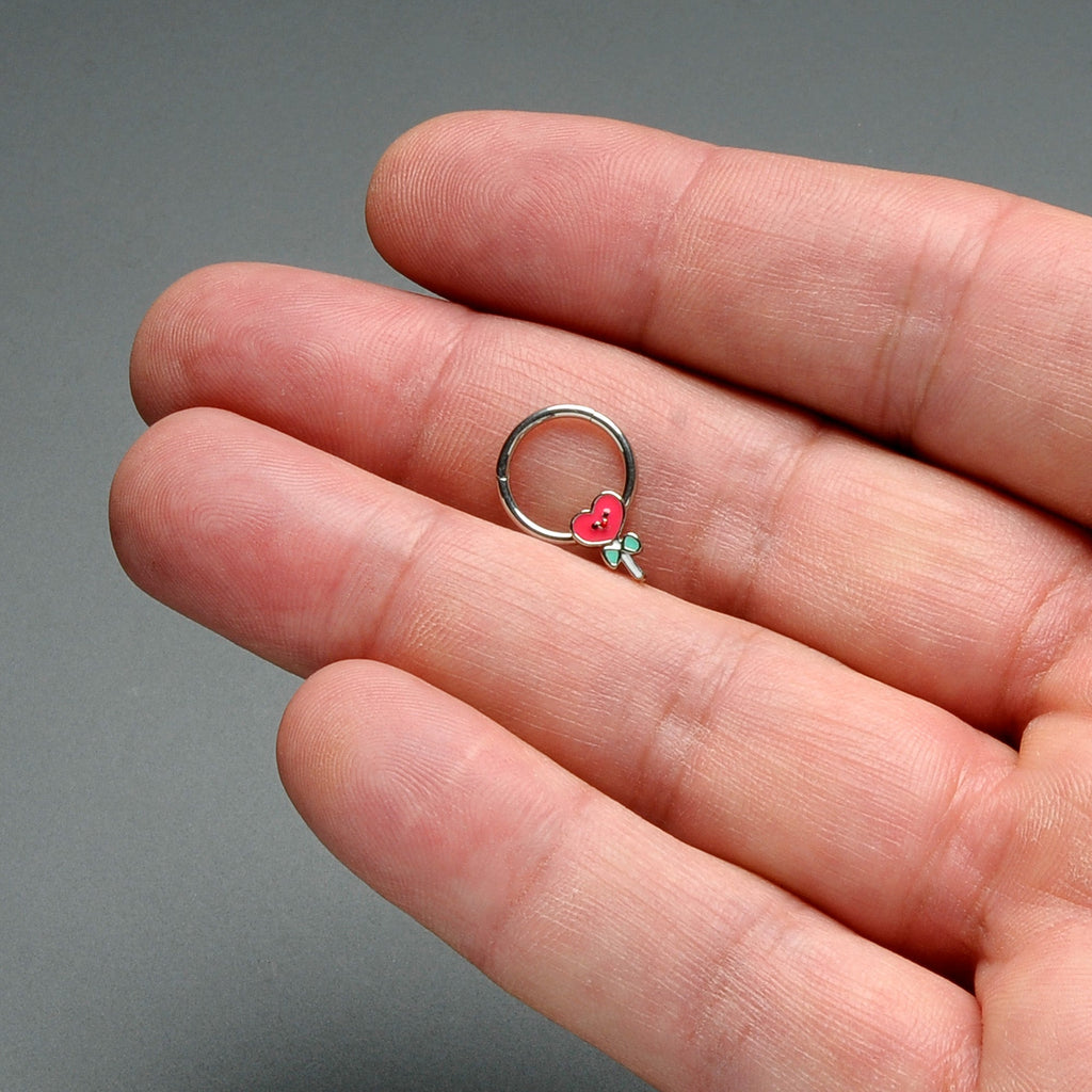 BodyCandy 16G 3/8 Sweet Happy Heart Lollipop Hinged Segment Ring — in-use photo