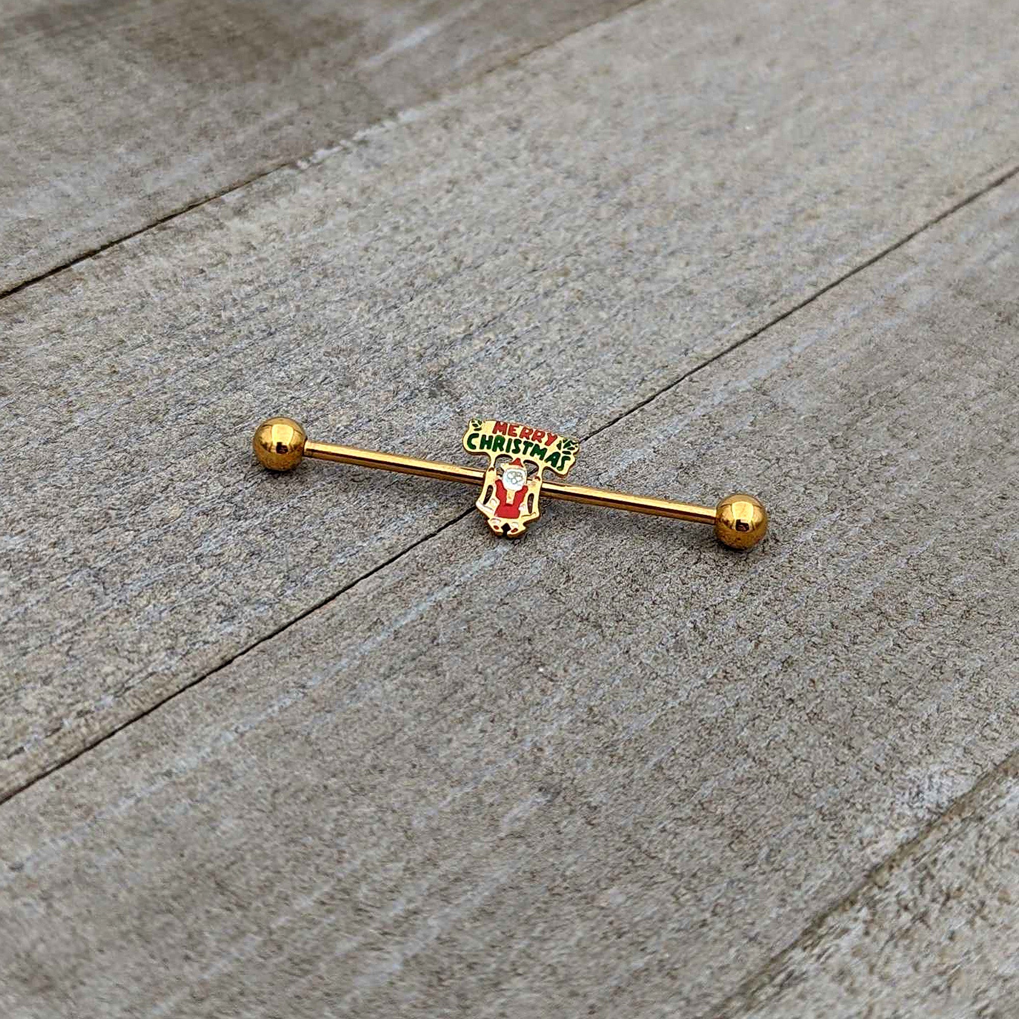 BodyCandy 14G Gold Hue Merry Christmas Santa Inlaid Industrial Barbell 38mm — in-use photo