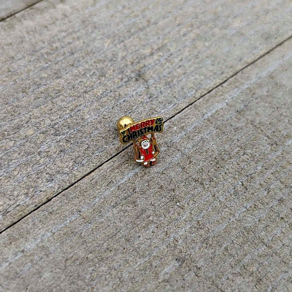 BodyCandy 16G 1/4 Gold Tone Merry Christmas Santa Inlay Cartilage Earring — in-use photo