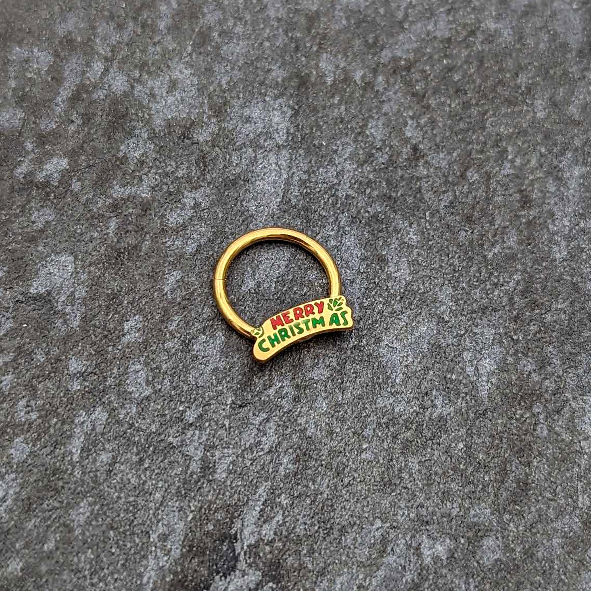 BodyCandy 16G 3/8 Gold Tone Merry Christmas Inlay Hinged Segment Ring — side view