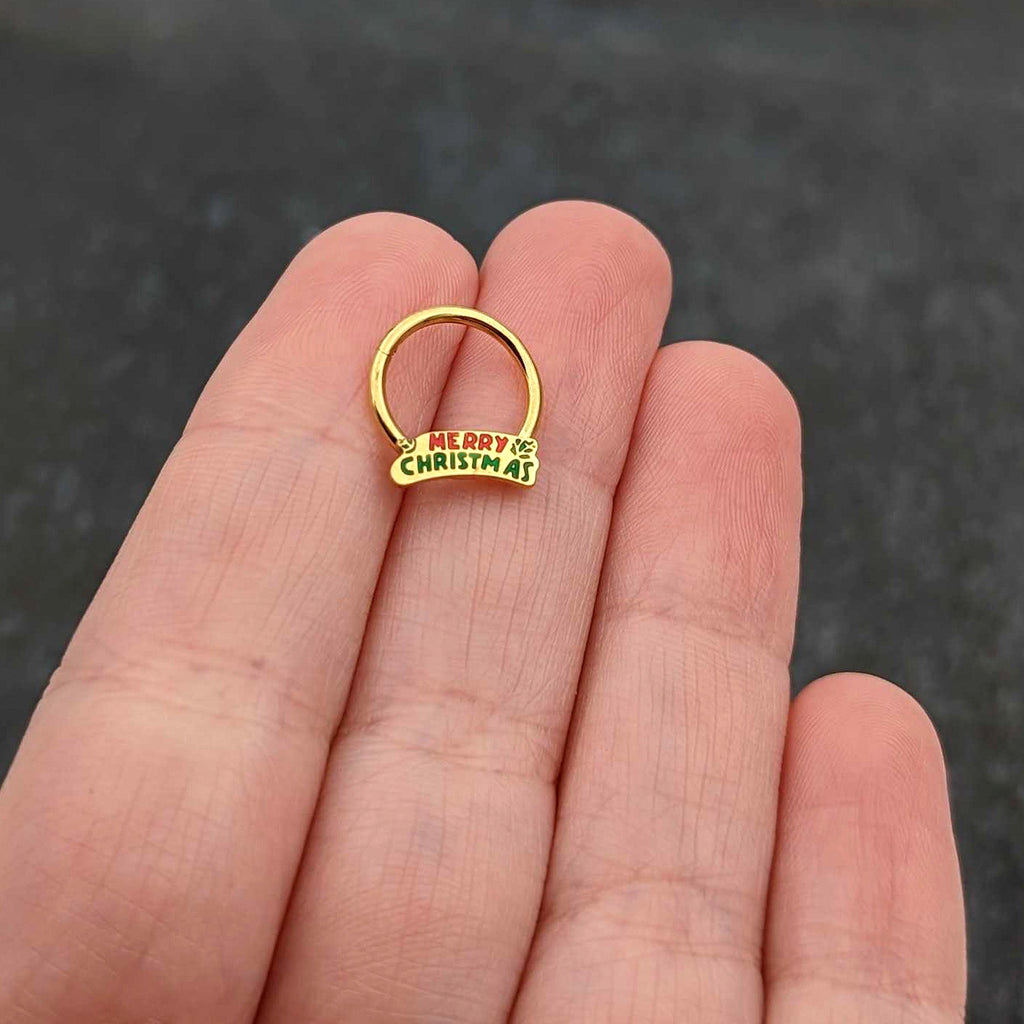 BodyCandy 16G 3/8 Gold Tone Merry Christmas Inlay Hinged Segment Ring — size reference