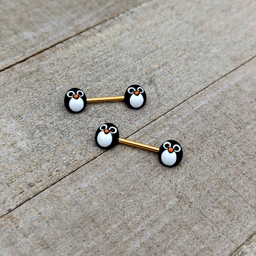 BodyCandy 14G 9/16 Gold Tone Round Penguin Face Barbell Nipple Ring Set — in-use photo
