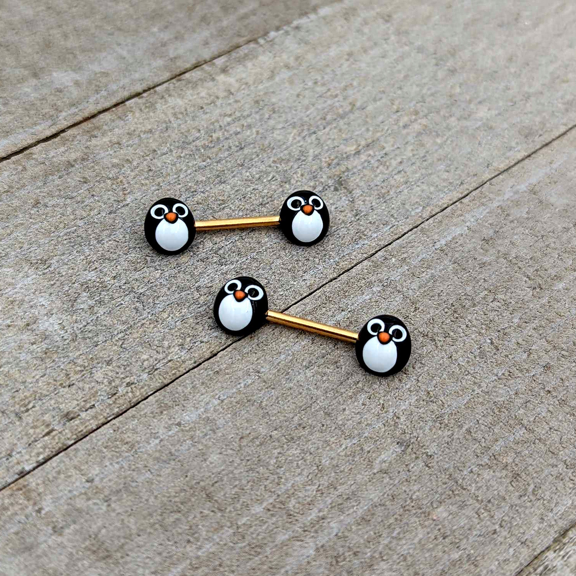 BodyCandy 14G 9/16 Gold Tone Round Penguin Face Barbell Nipple Ring Set — in-use photo