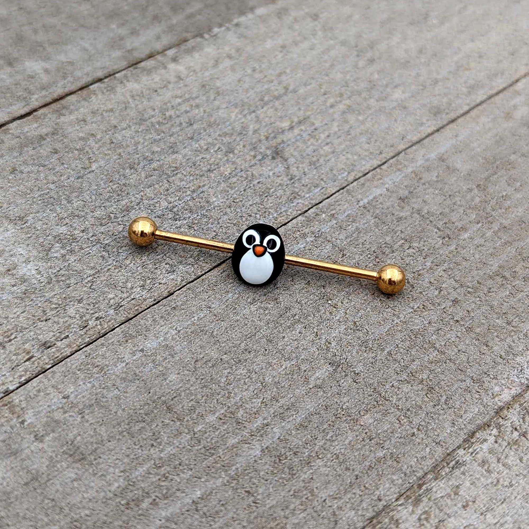 BodyCandy 14G Gold Tone Round Penguin Face Holiday Industrial Barbell 38mm — in-use photo