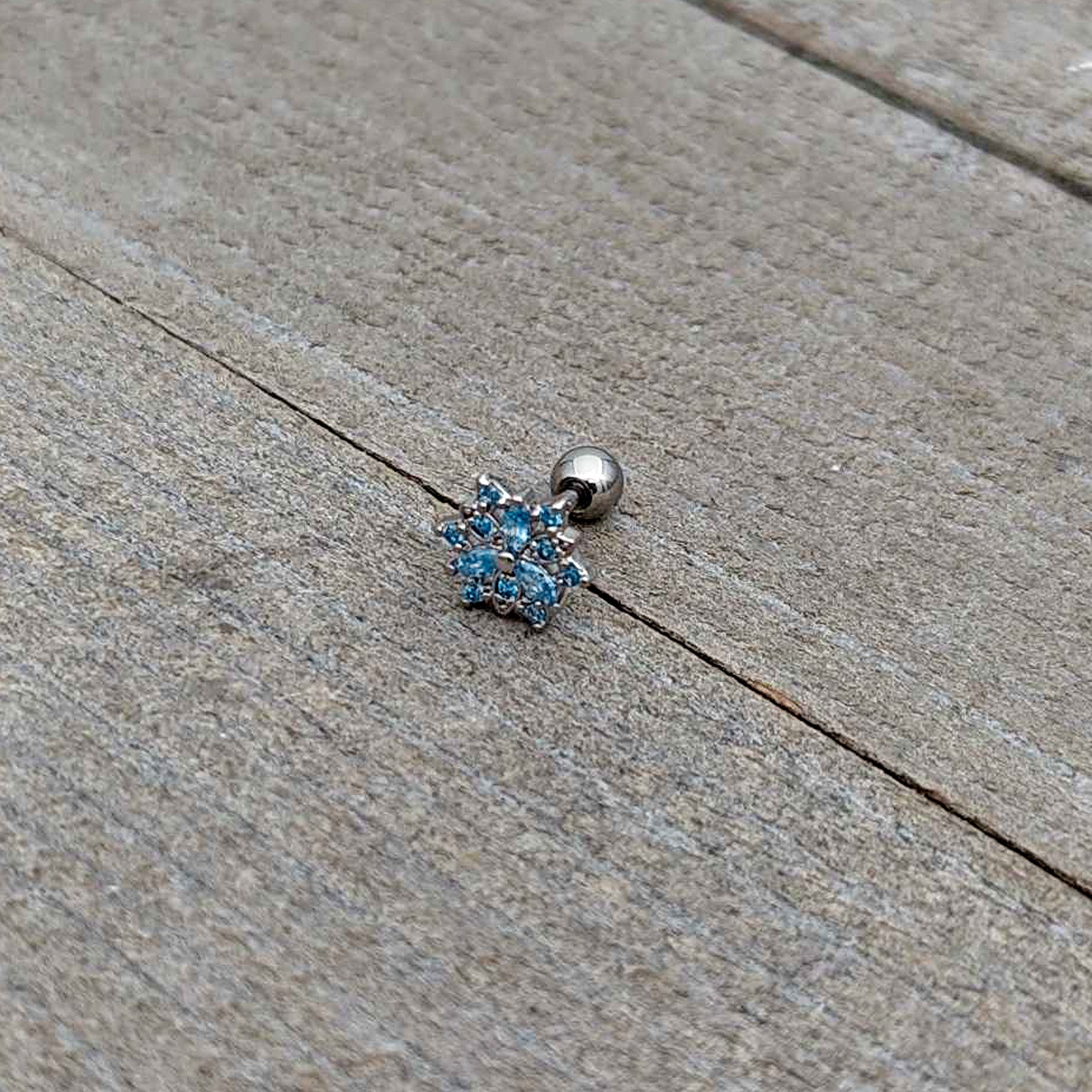 BodyCandy 16G 1/4 Blue CZ Gem Snowflake Blues Cartilage Tragus Earring — in-use photo