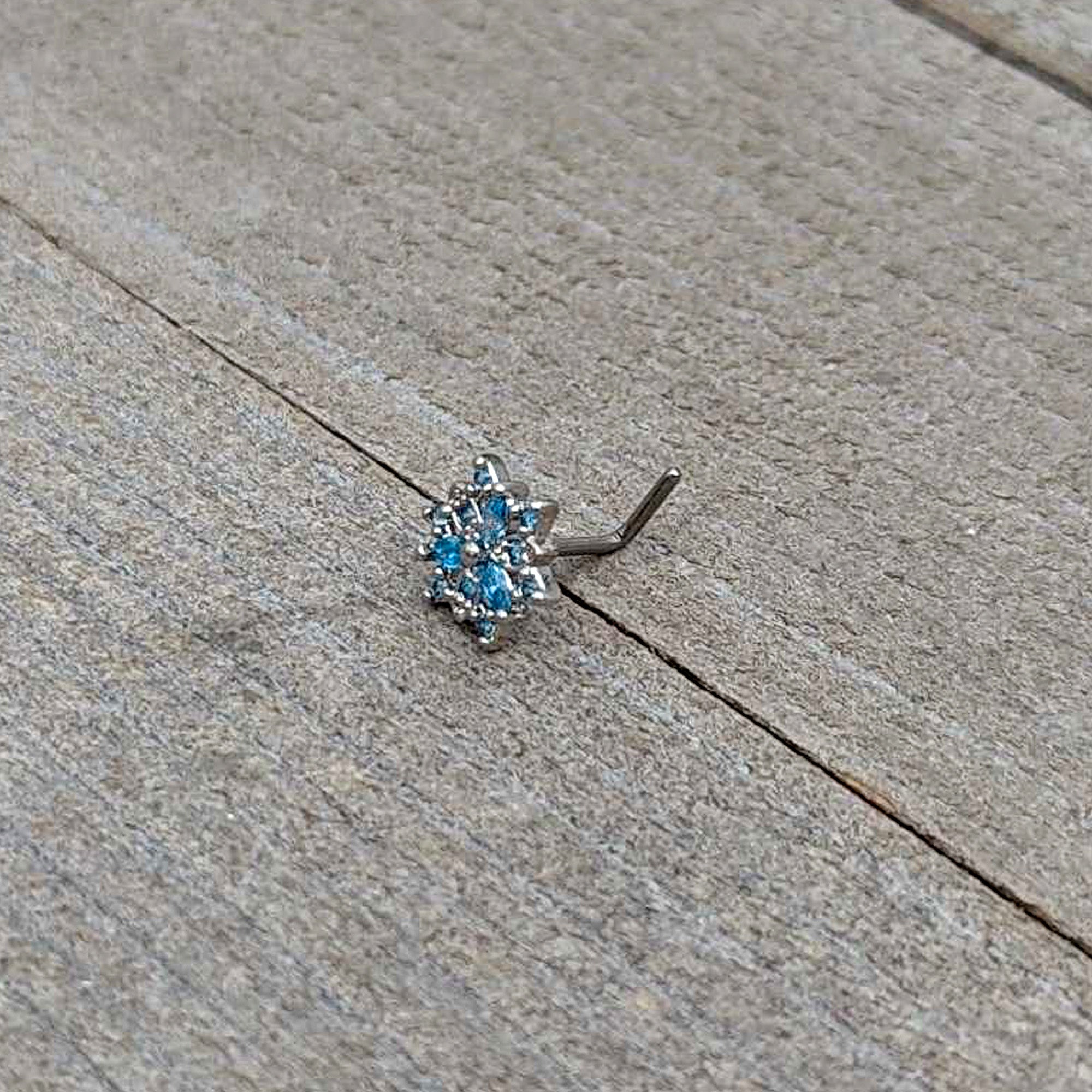 BodyCandy 20G 7mm Blue CZ Gem Snowflake Blues L Shape Nose Ring — in-use photo