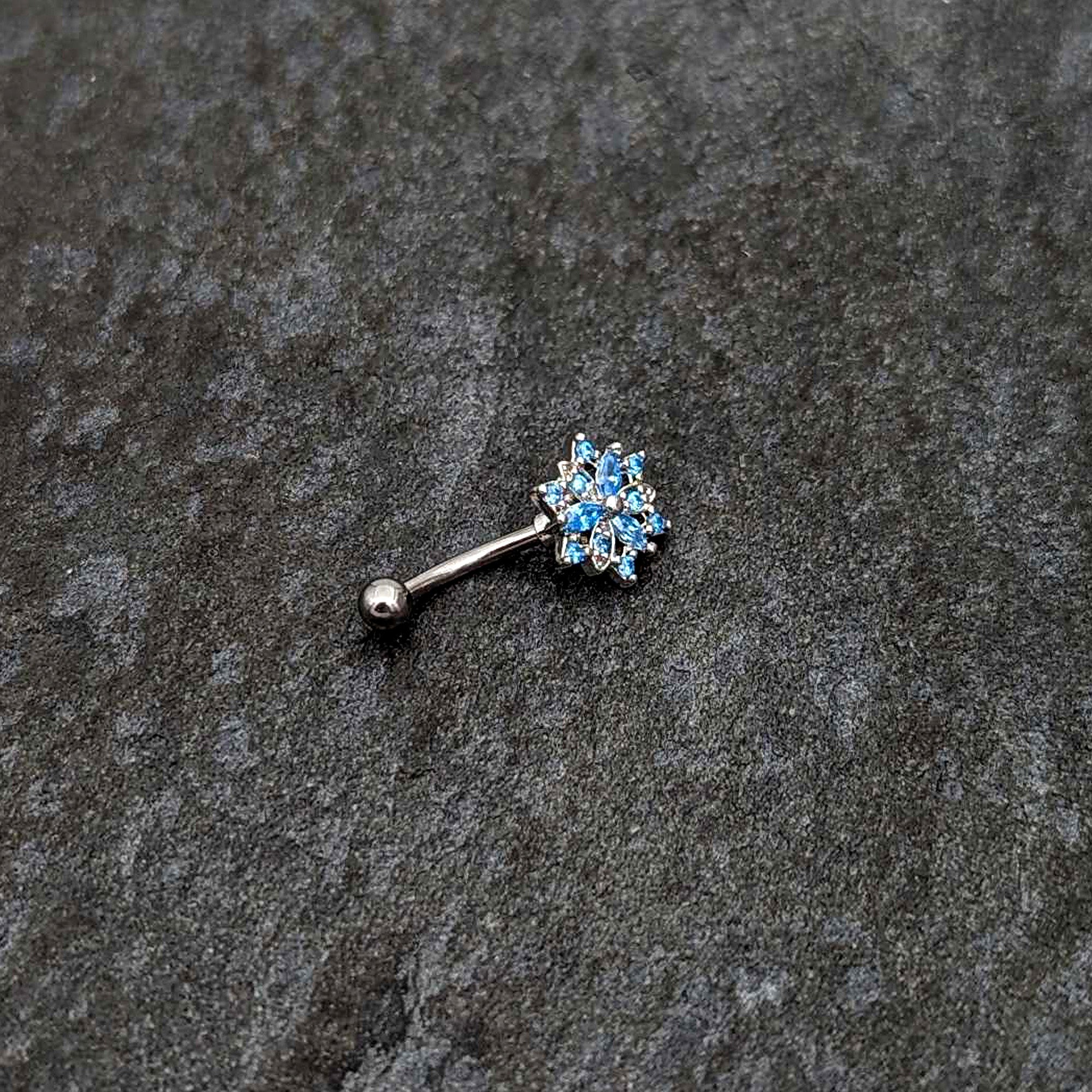 BodyCandy 16G 5/16 Blue CZ Gem Snowflake Blues Curved Eyebrow Ring — side view