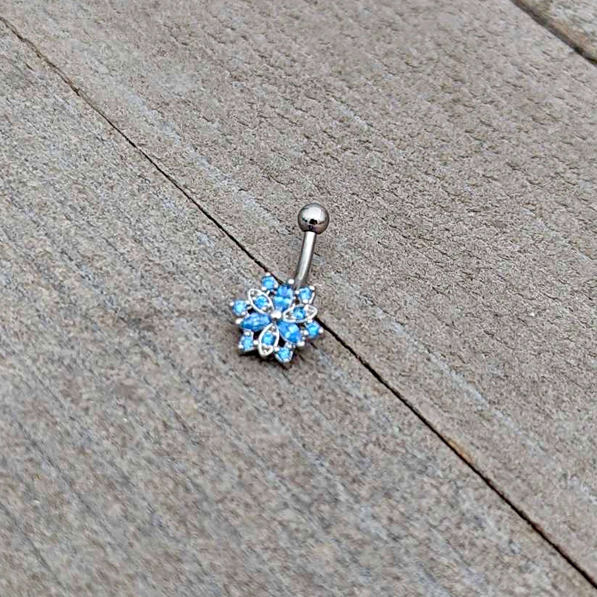 BodyCandy 16G 5/16 Blue CZ Gem Snowflake Blues Curved Eyebrow Ring — alternative angle