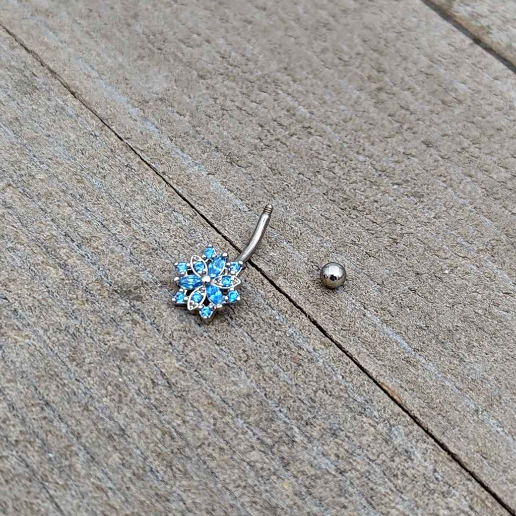 BodyCandy 16G 5/16 Blue CZ Gem Snowflake Blues Curved Eyebrow Ring — in-use photo