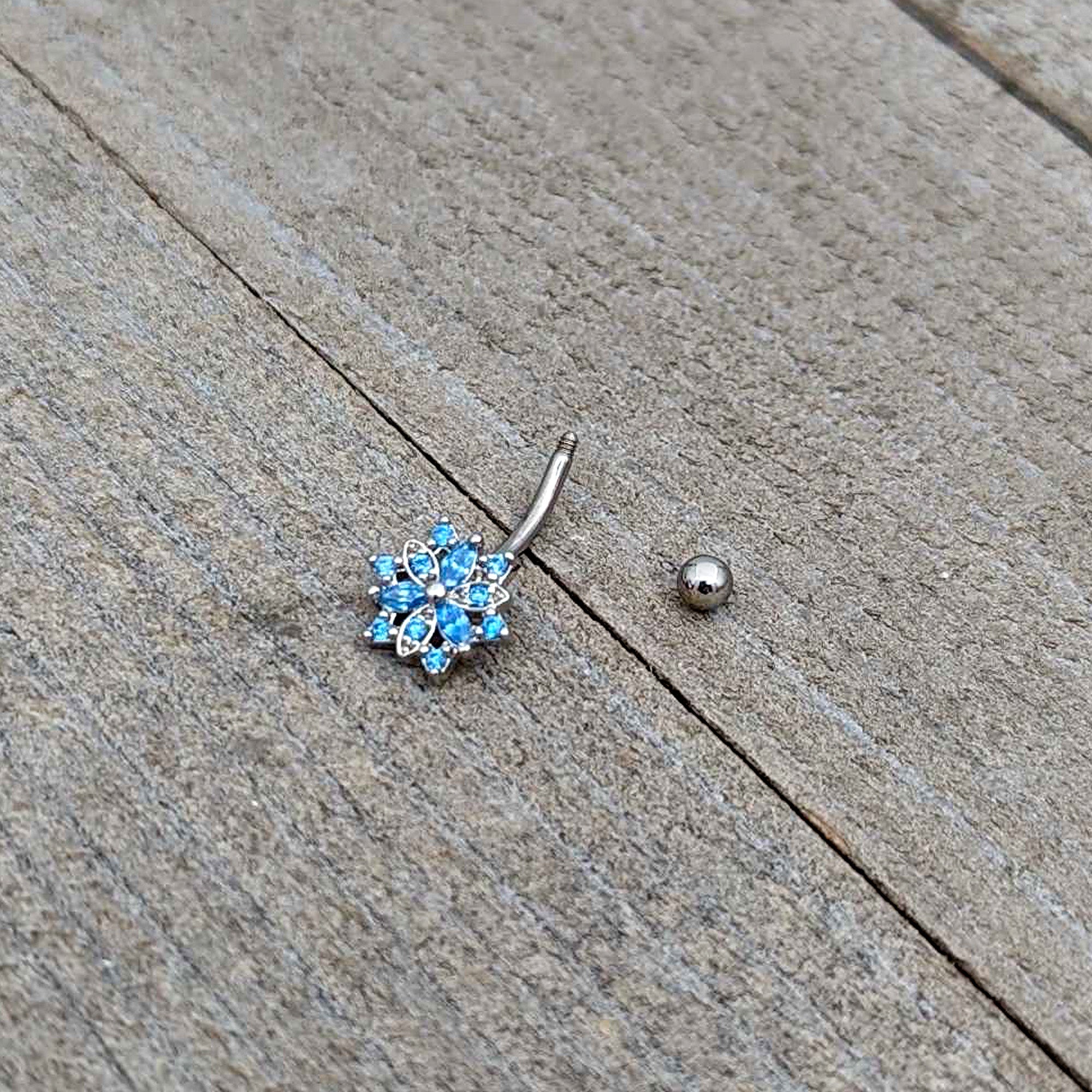 BodyCandy 16G 5/16 Blue CZ Gem Snowflake Blues Curved Eyebrow Ring — in-use photo