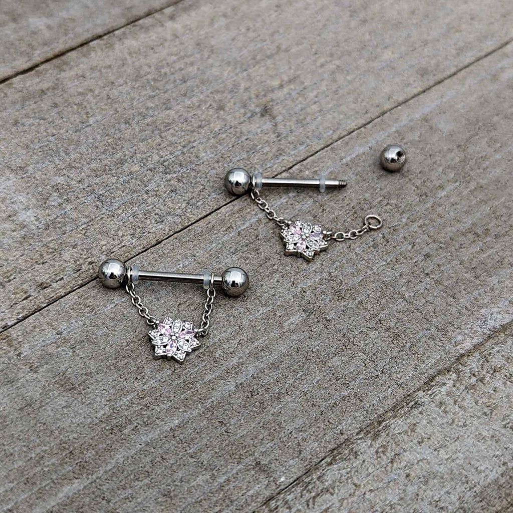 BodyCandy 14G 9/16 Pink Clear CZ Gem Snowflake Chain Dangle Nipple Ring Set — in-use photo