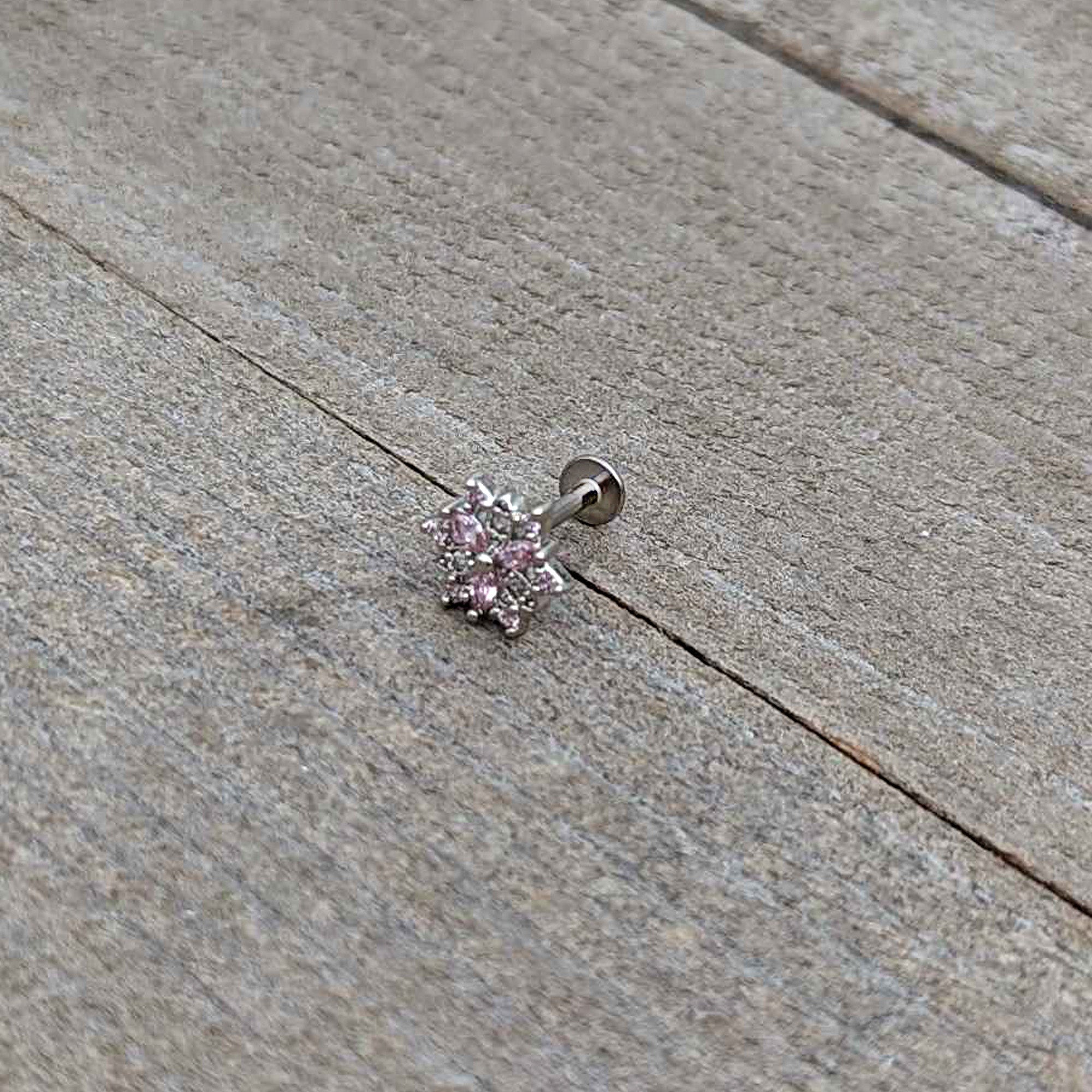 BodyCandy 16G 5/16 Pink Clear CZ Gem Snowflake Labret Monroe Tragus — in-use photo