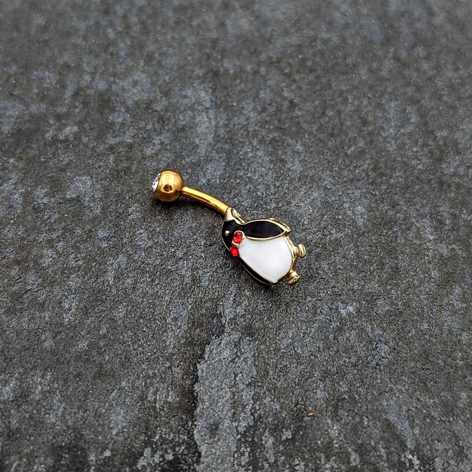 BodyCandy Clear Red Gem Gold Tone Bow Tie Penguin Holiday Belly Ring — side view