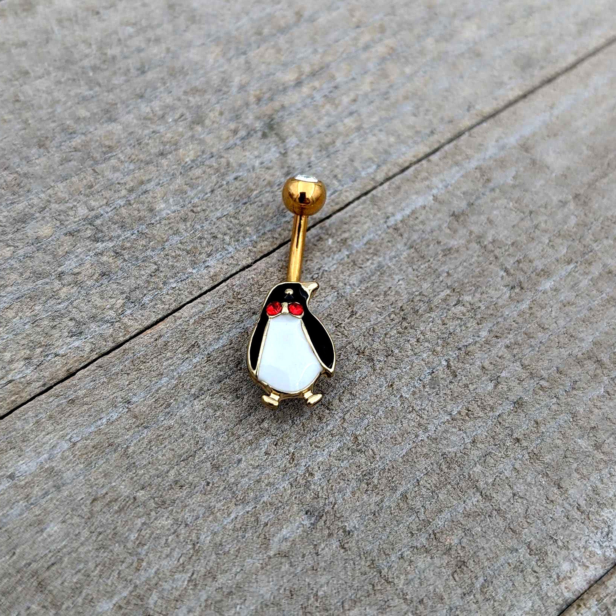 BodyCandy Clear Red Gem Gold Tone Bow Tie Penguin Holiday Belly Ring — in-use photo