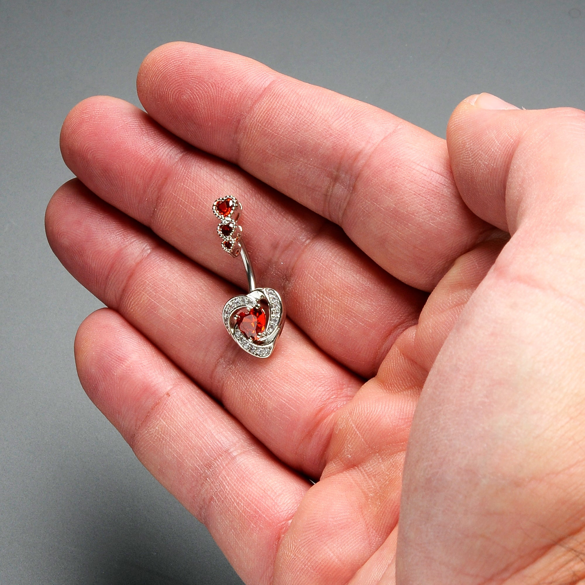 BodyCandy Red CZ Gem Triple Drop Swirl Heart Valentine Double Mount Belly Ring — detail close-up