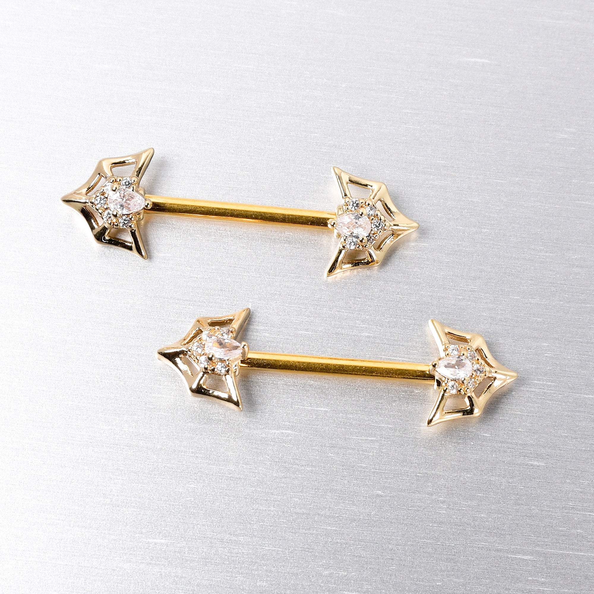 BodyCandy 14G 5/8 Clear Gem Gold Tone Spider Bat Barbell Nipple Ring Set — side view