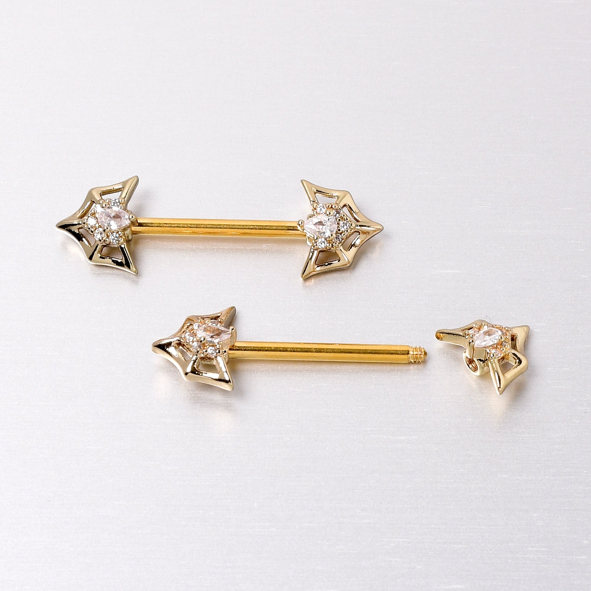 BodyCandy 14G 5/8 Clear Gem Gold Tone Spider Bat Barbell Nipple Ring Set — back view