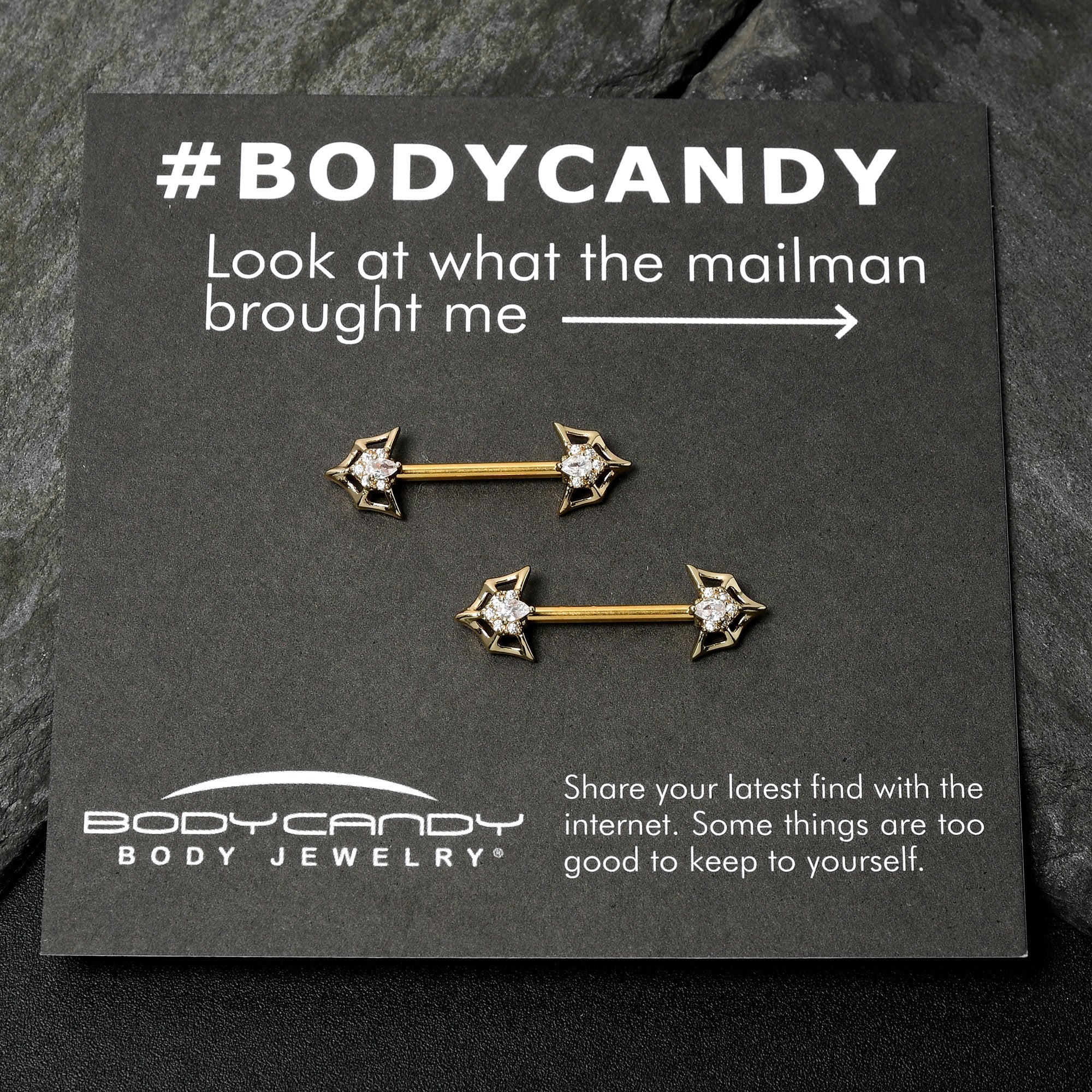 BodyCandy 14G 5/8 Clear Gem Gold Tone Spider Bat Barbell Nipple Ring Set — in-use photo