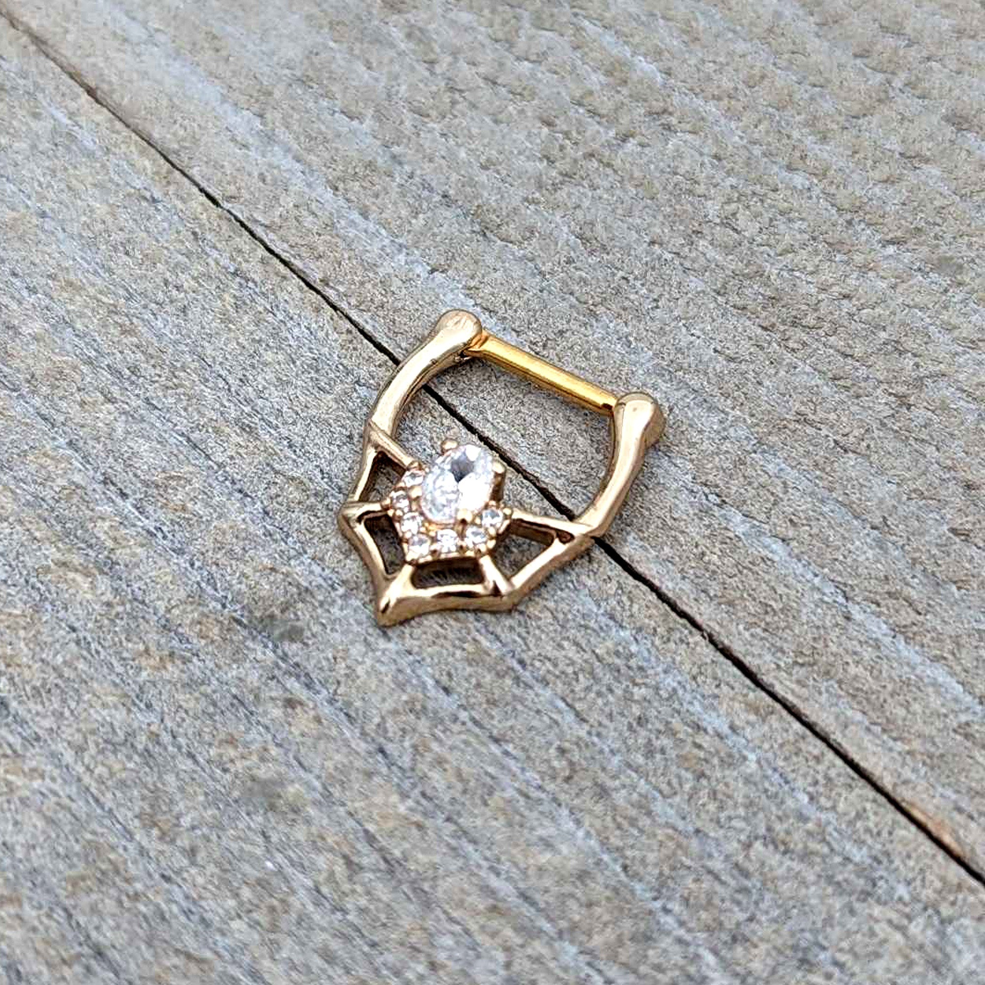 BodyCandy 16G 5/16 Clear Gem Gold Tone Spider Bat Cartilage Clicker — in-use photo
