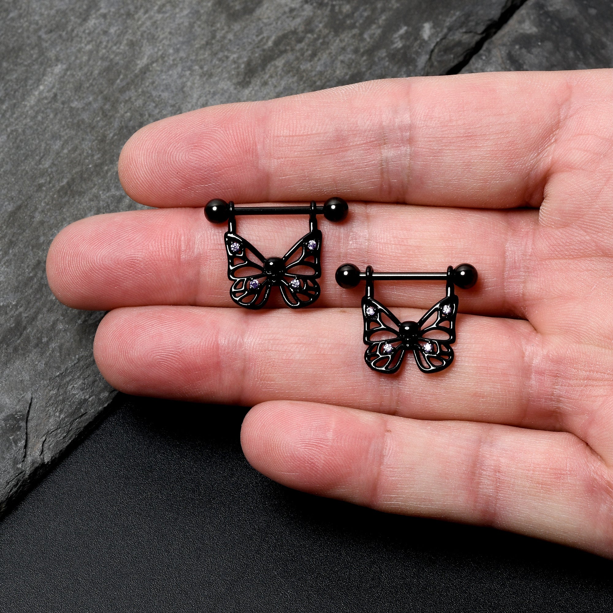 BodyCandy 14G 11/16 Purple CZ Gem Black Skull Butterfly Dangle Nipple Ring Set — lifestyle context
