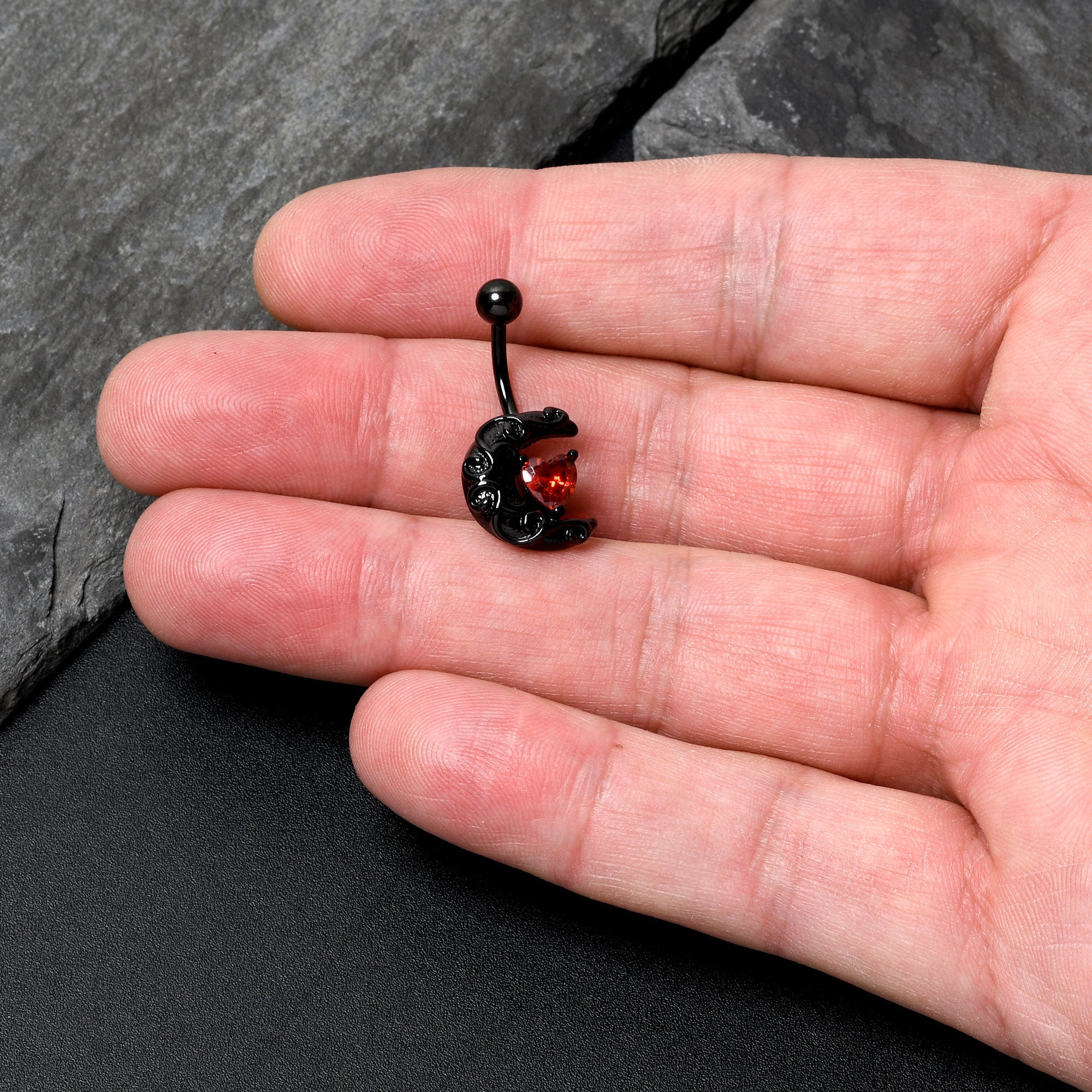 BodyCandy Red CZ Gem Black Scroll Moon Heart Belly Ring — detail close-up