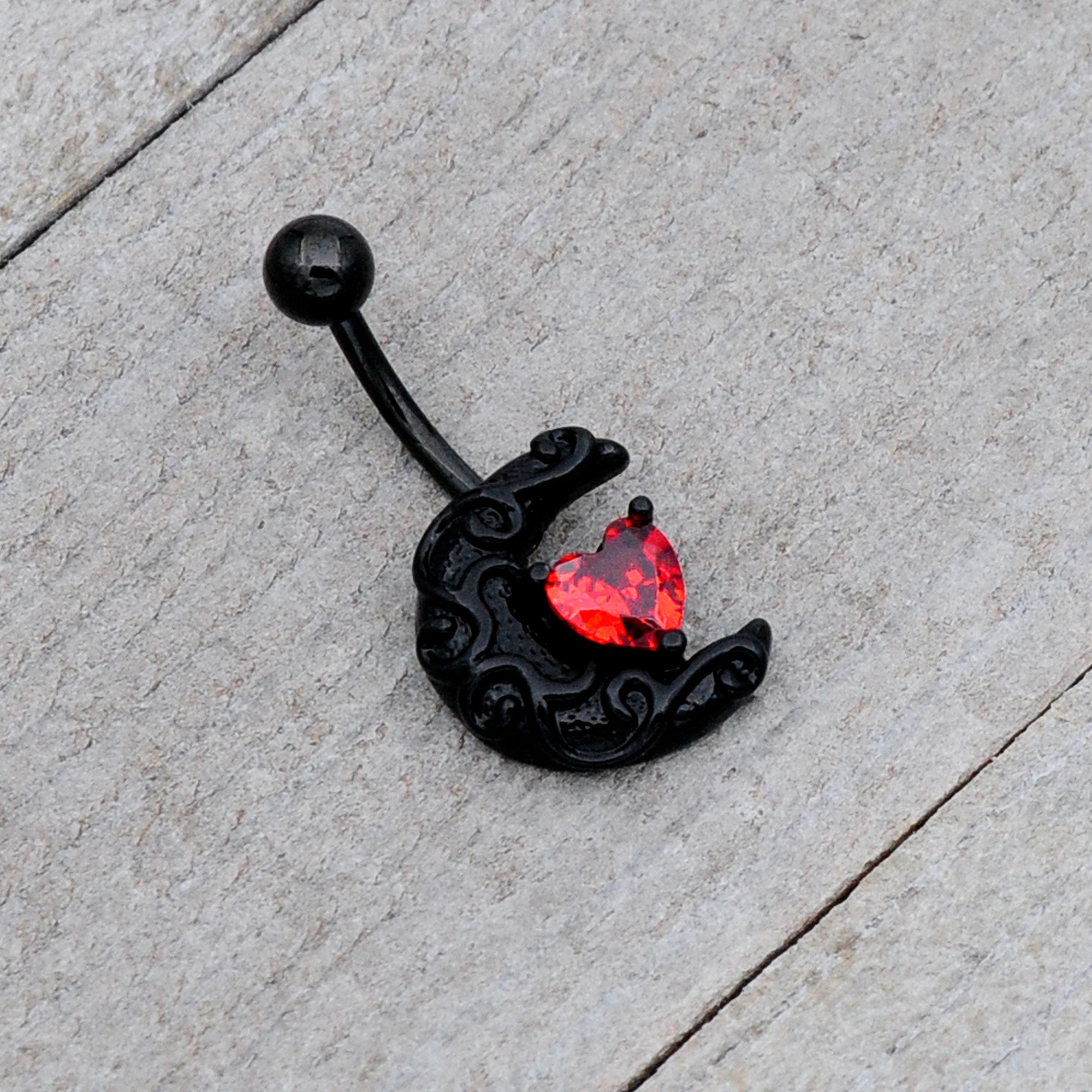 BodyCandy Red CZ Gem Black Scroll Moon Heart Belly Ring — lifestyle context