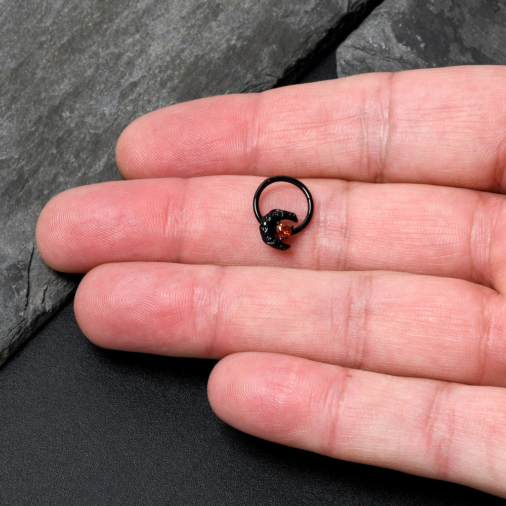 BodyCandy 16G 3/8 Red CZ Gem Black Scroll Moon Heart Hinged Segment Ring — lifestyle context