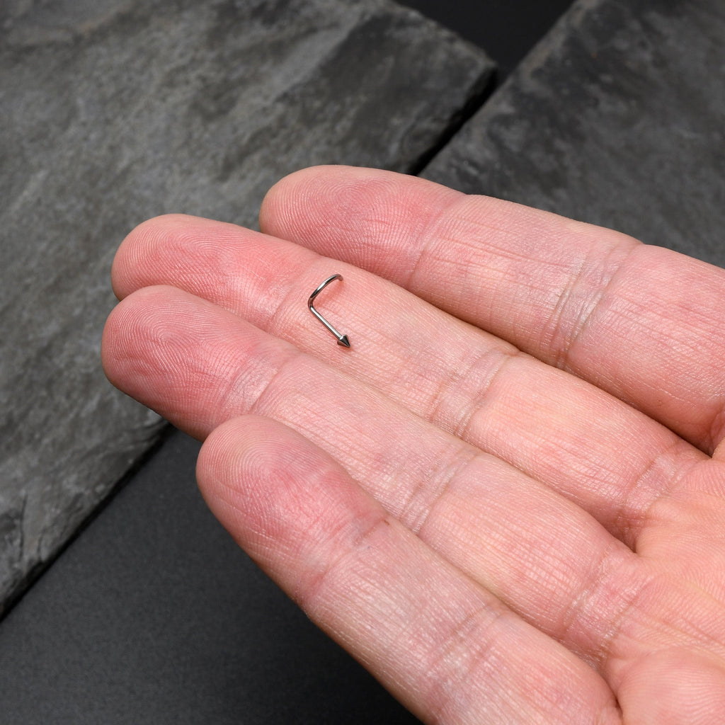 BodyCandy 20G 1/4 ASTM F-136 Implant Grade Titanium Cone End Left Side Nose Screw — lifestyle context