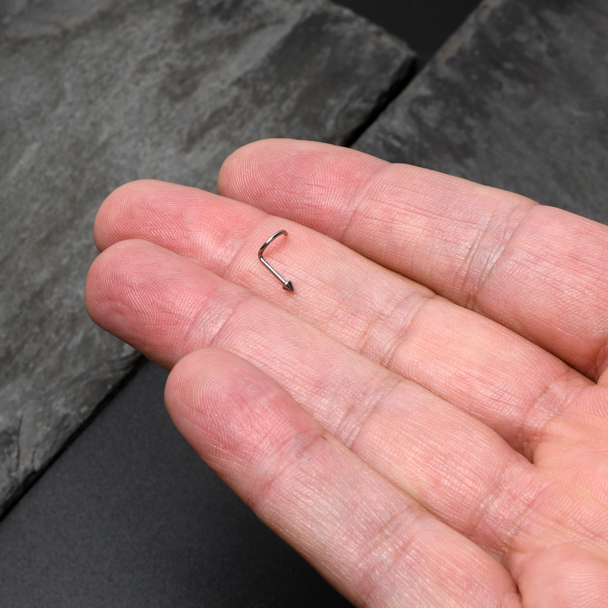 BodyCandy 20G 1/4 ASTM F-136 Implant Grade Titanium Cone End Left Side Nose Screw — lifestyle context
