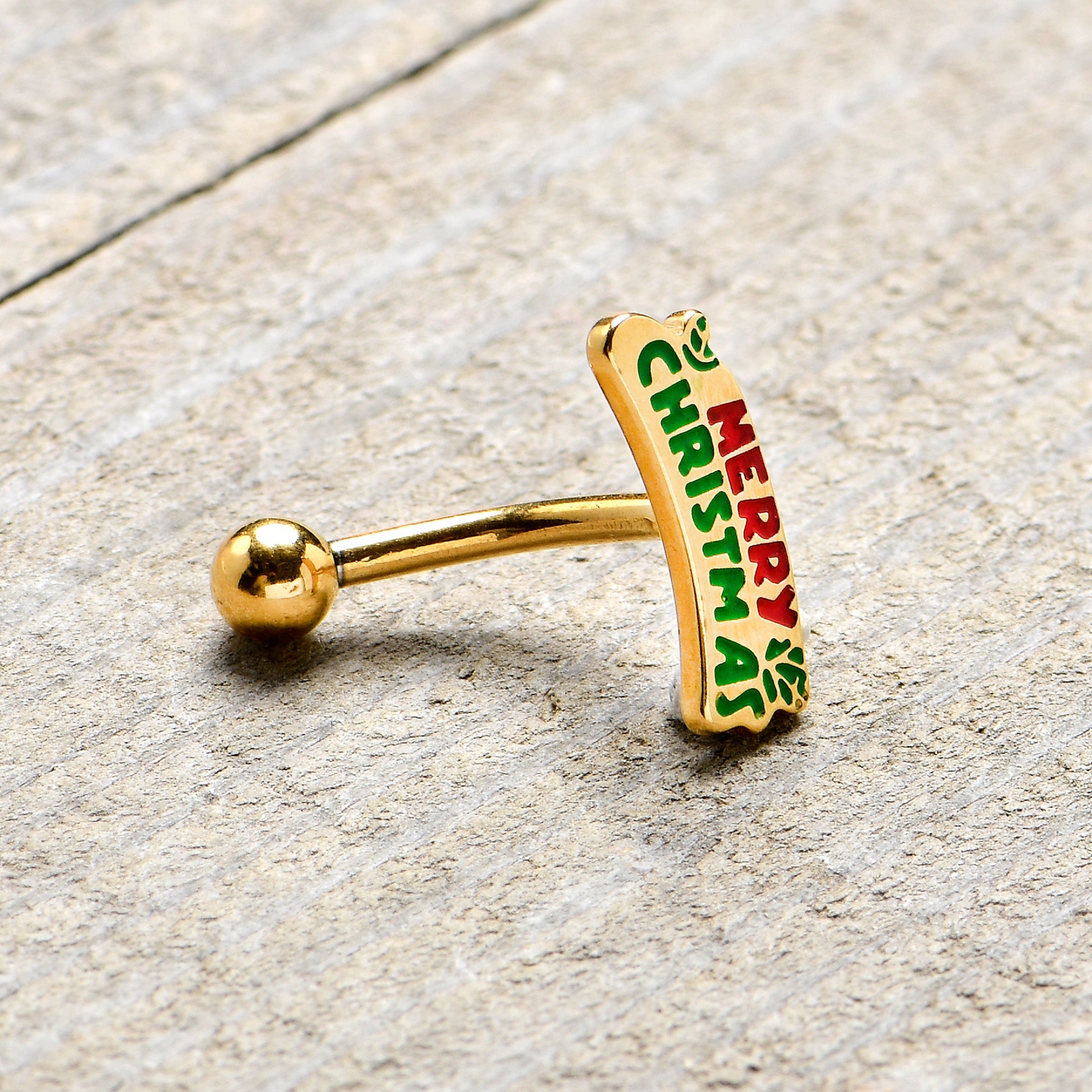 BodyCandy 16G 5/16 Gold Tone Merry Christmas Inlay Curved Barbell Ring — lifestyle context