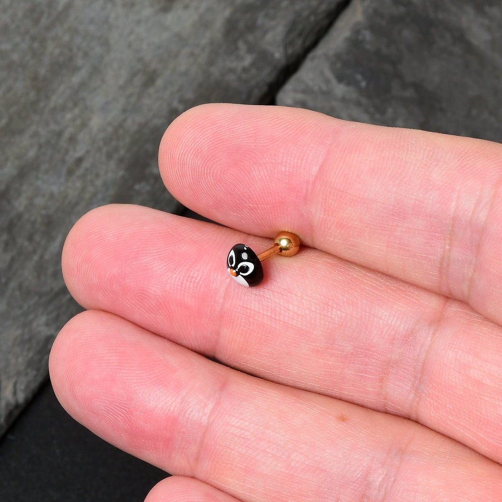 BodyCandy 16G 1/4 Gold Tone Round Penguin Face Holiday Cartilage Earring — in-use photo