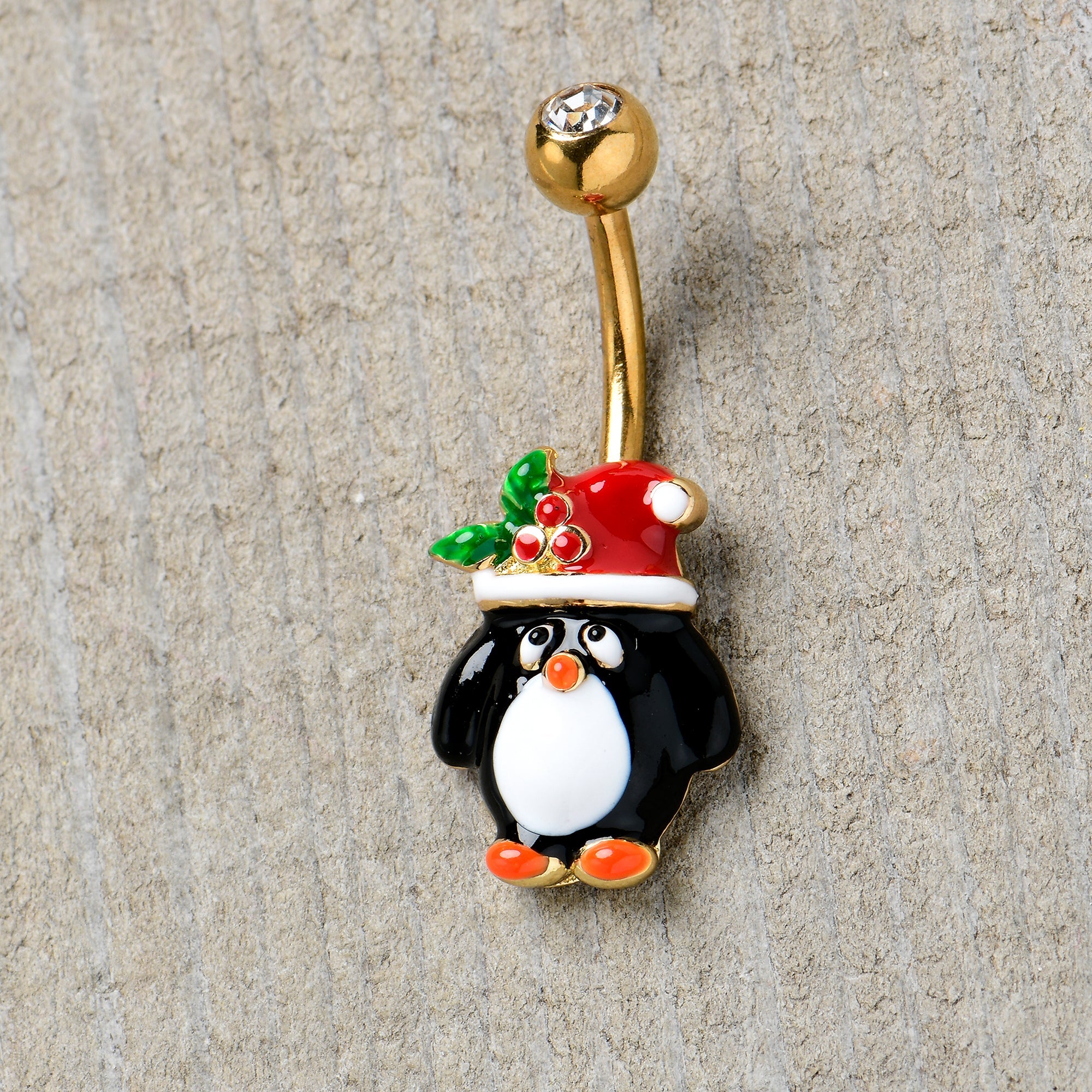 BodyCandy Clear Gem Gold Tone Holly Hat Penguin Holiday Belly Ring — detail close-up