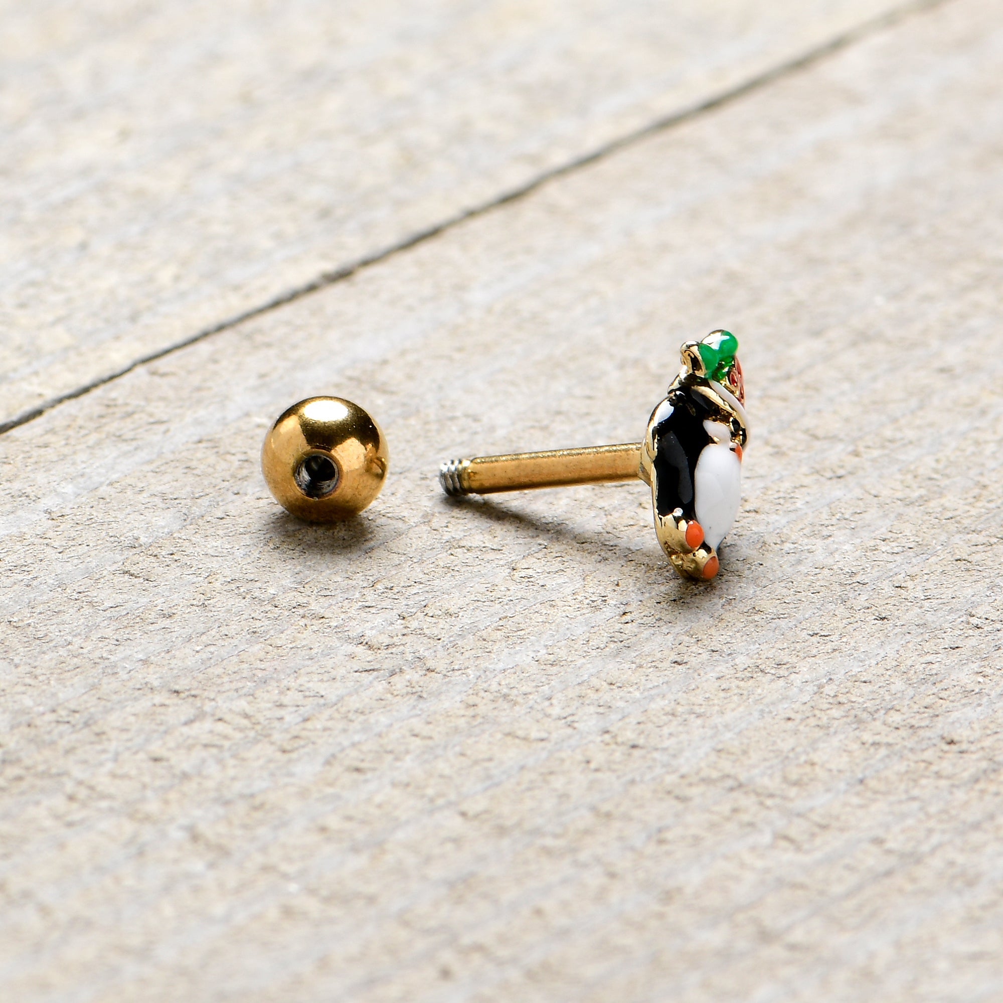 BodyCandy 16G 1/4 Gold Tone Holly Hat Penguin Cartilage Tragus Earring — back view