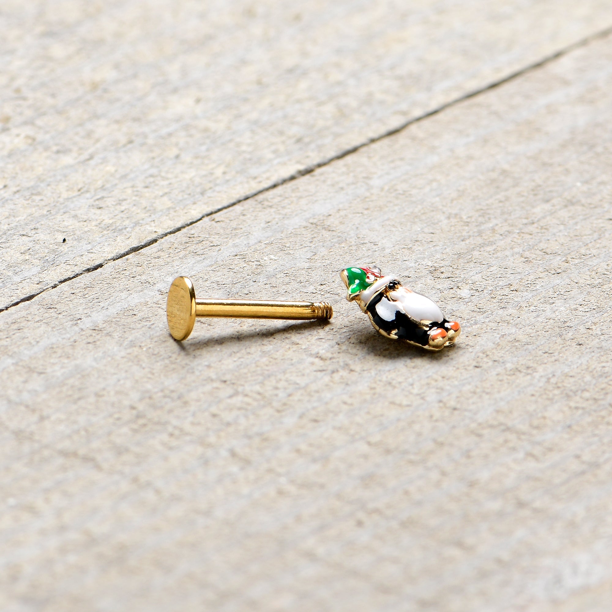 BodyCandy 16G 5/16 Gold Tone Holly Hat Penguin Holiday Labret Monroe Tragus — back view