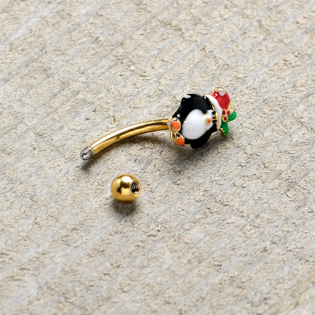 BodyCandy 16G 5/16 Gold Tone Holly Hat Penguin Holiday Curved Eyebrow Ring — lifestyle context