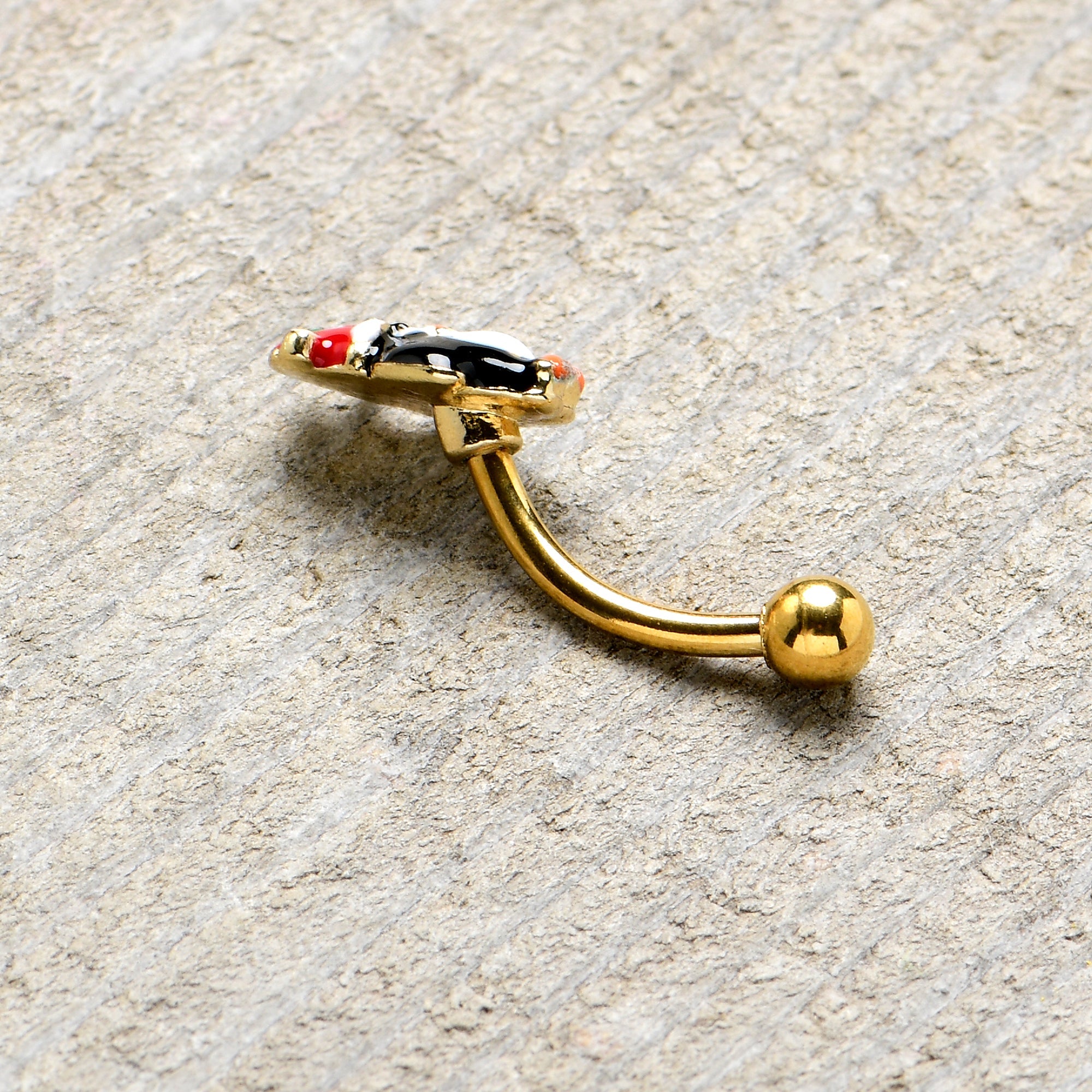 BodyCandy 16G 5/16 Gold Tone Holly Hat Penguin Holiday Curved Eyebrow Ring — in-use photo