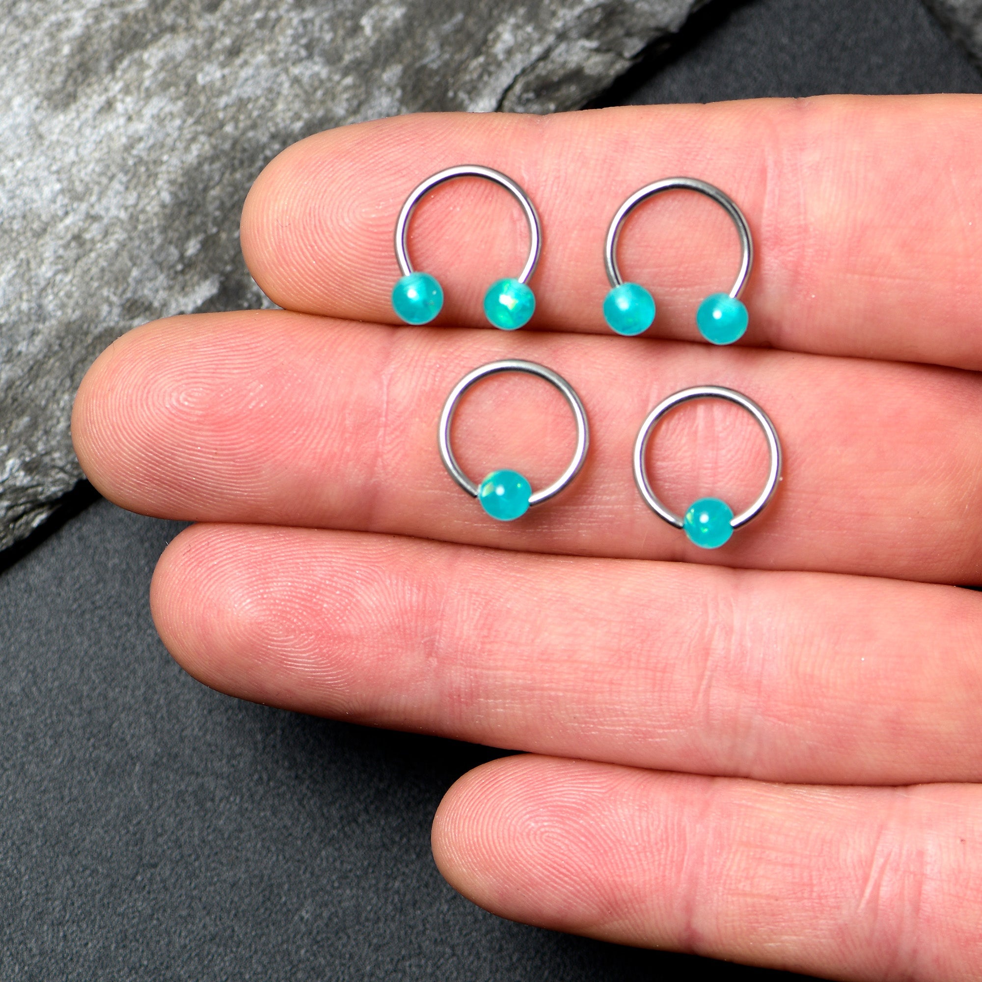 BodyCandy 16G 3/8 Teal Faux Opal Horseshoe BCR Captive Ring Set of 4 — lifestyle context