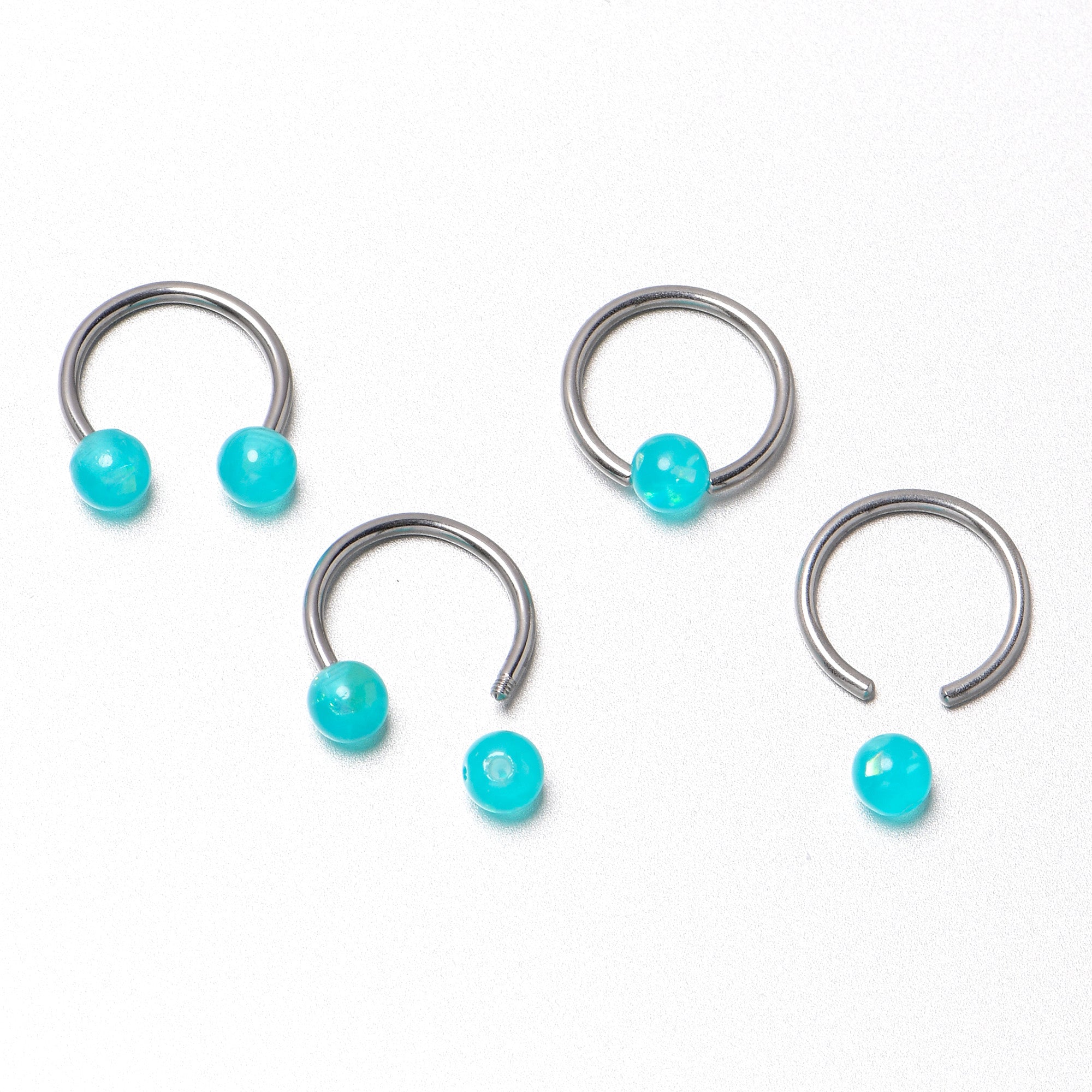 BodyCandy 16G 3/8 Teal Faux Opal Horseshoe BCR Captive Ring Set of 4 — in-use photo